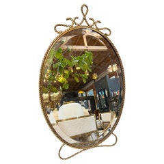 Oval Brass Vanity Mirror with Decorative Frame