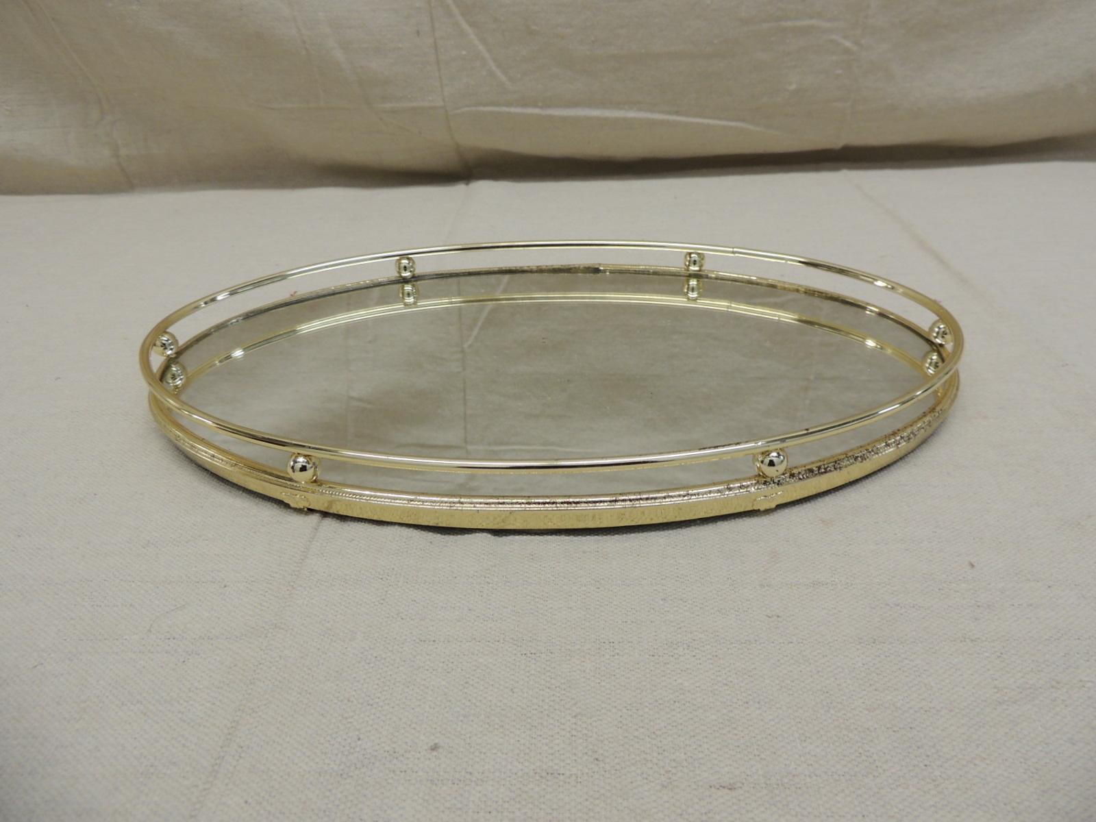Oval Brass vanity tray
With mirror inset, ball and tubular apron
Felt bottom
Size: 13.5
