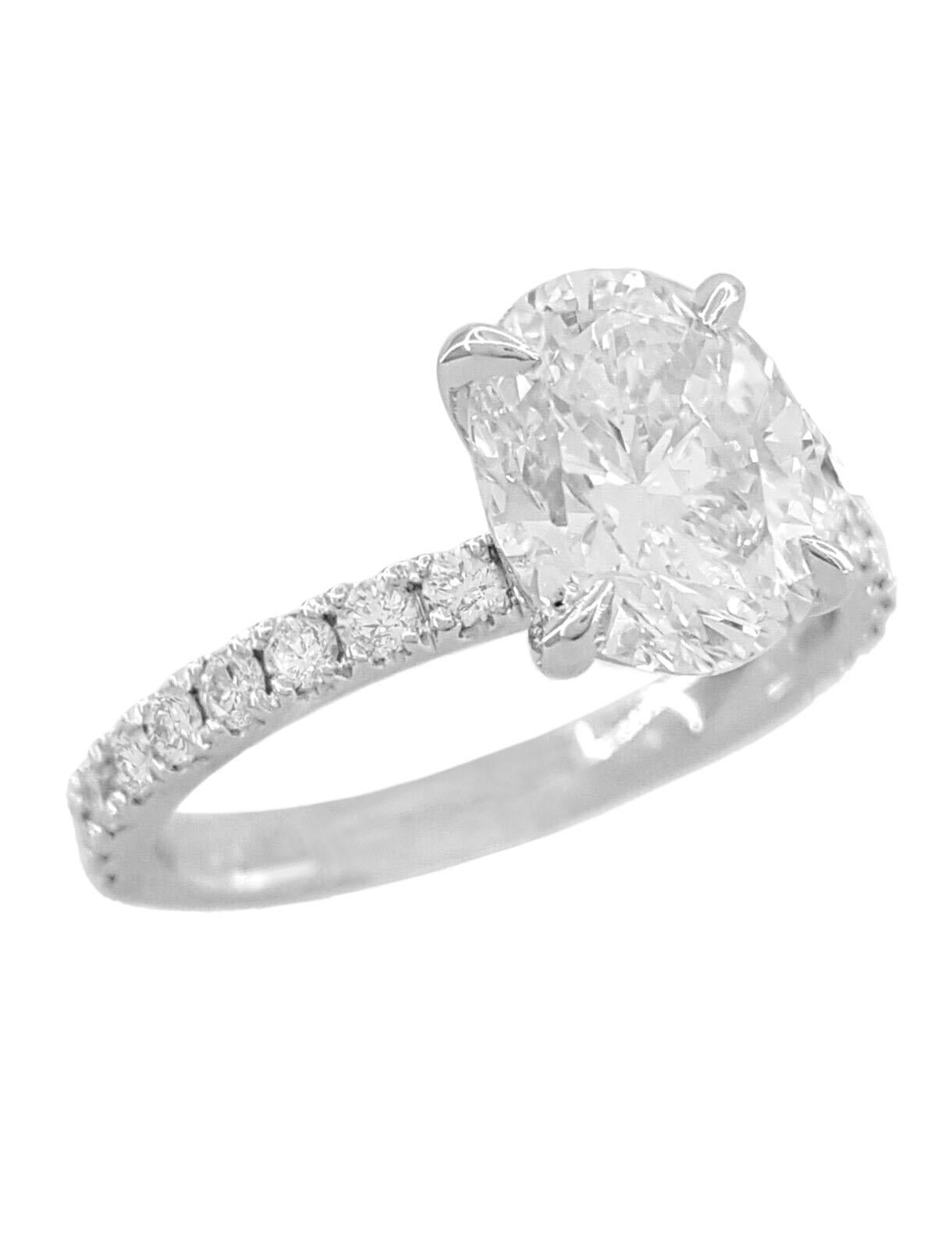 Oval Brilliant Cut Diamond Halo 14k White Gold Engagement Ring. 

The ring weighs 3.1 grams, size 6.75, the center stone is a Natural Oval Brilliant Cut diamond weighing 0.7 ct, E in color, VVS2 in clarity, Good Polish, Good Symmetry & Faint