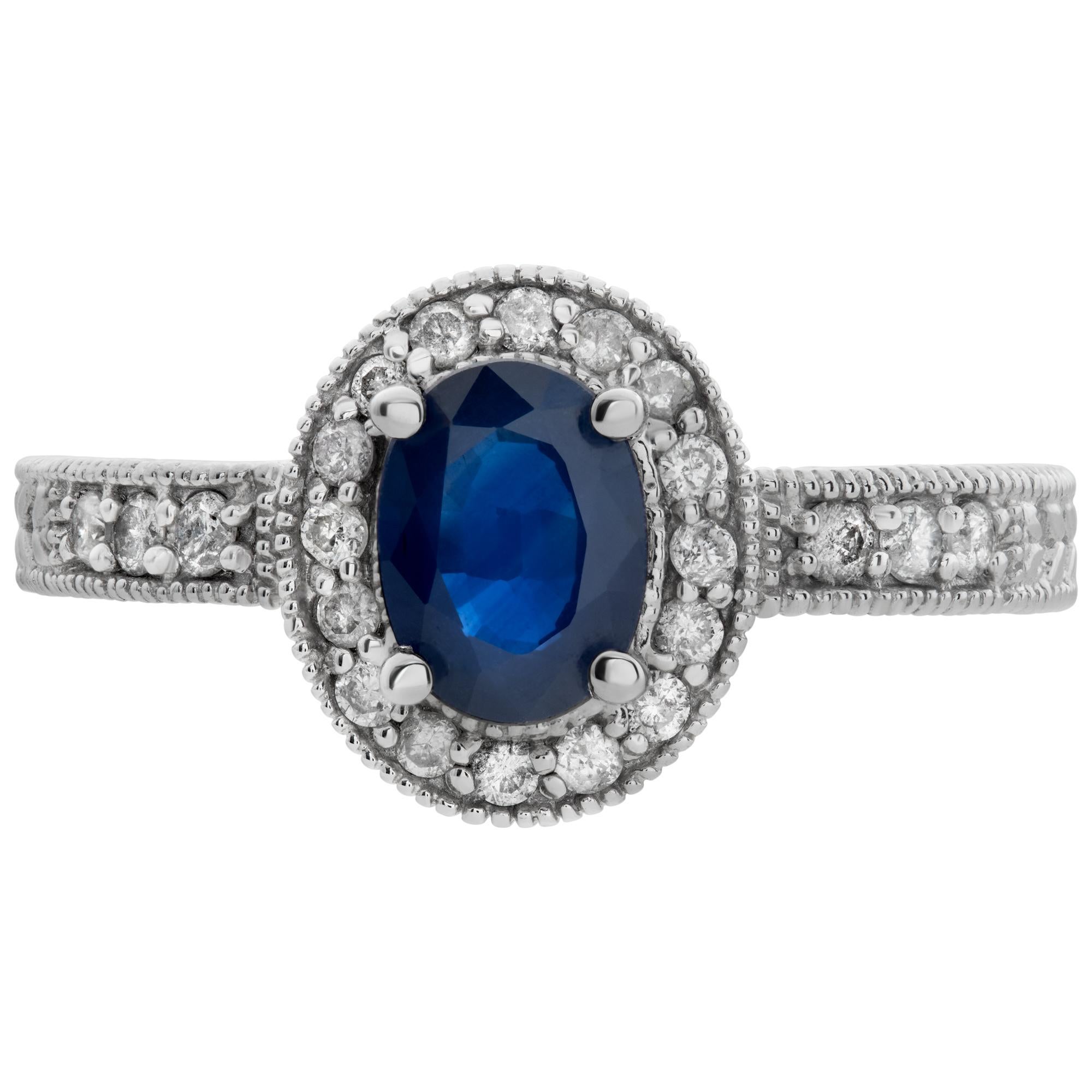 Oval brilliant cut sapphire & diamonds ring set in 14k white gold. Oval brilliant cut sapphire approx weight: 1.00 carat. Full cut round brilliant diamonds approx. total weight: 0.25 carat. Front: 12x 10 mm. Size 7This Diamond/Sapphires ring is