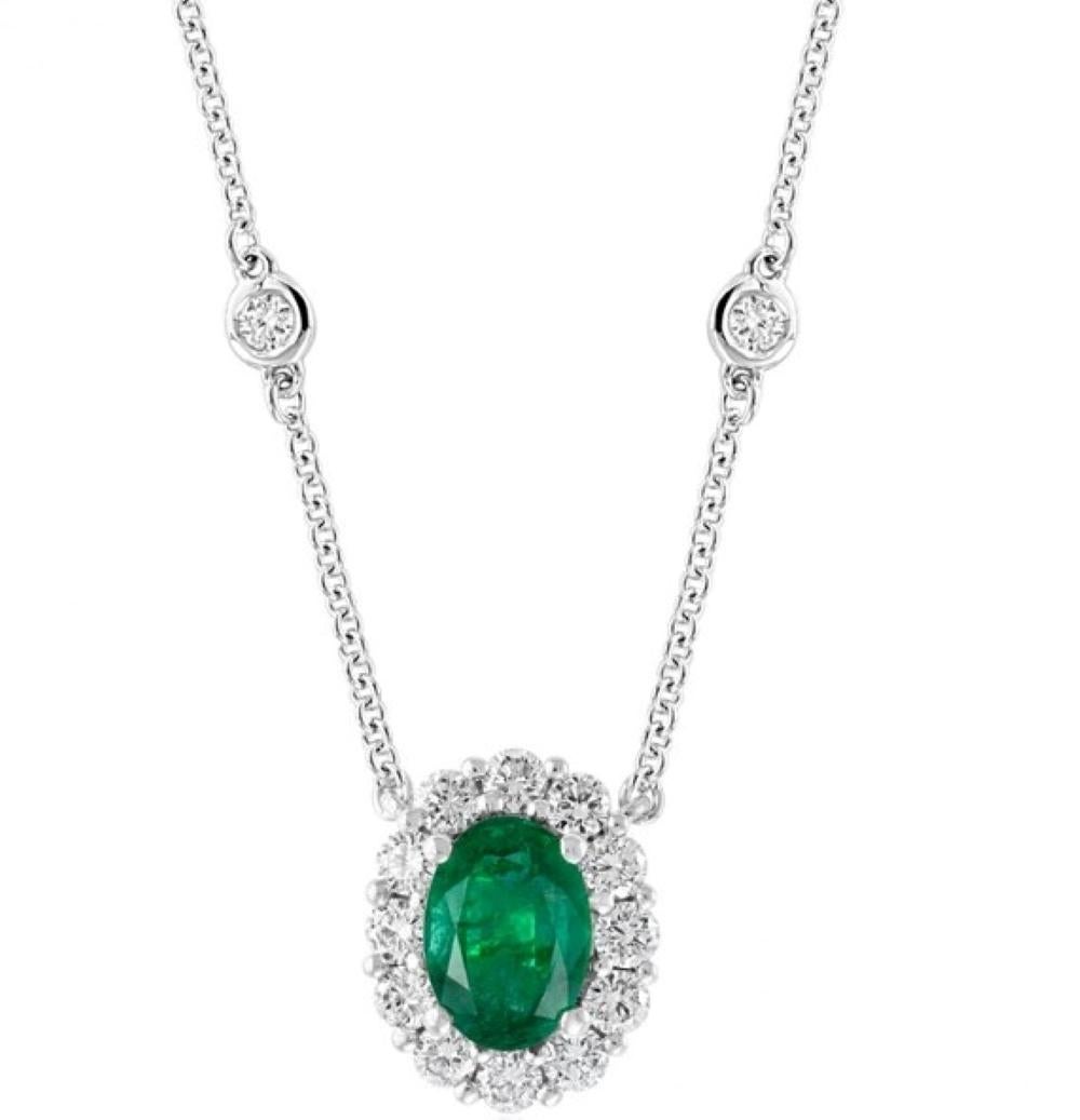 Emerald and Diamond Pendant with 1 Oval Emerald weighing .71 carats total and 16 Round Brilliant Cut Diamonds weighing .48 carats total, 18 karat white gold

Classic and clean, this highly executed design is easy to wear. With our design of the