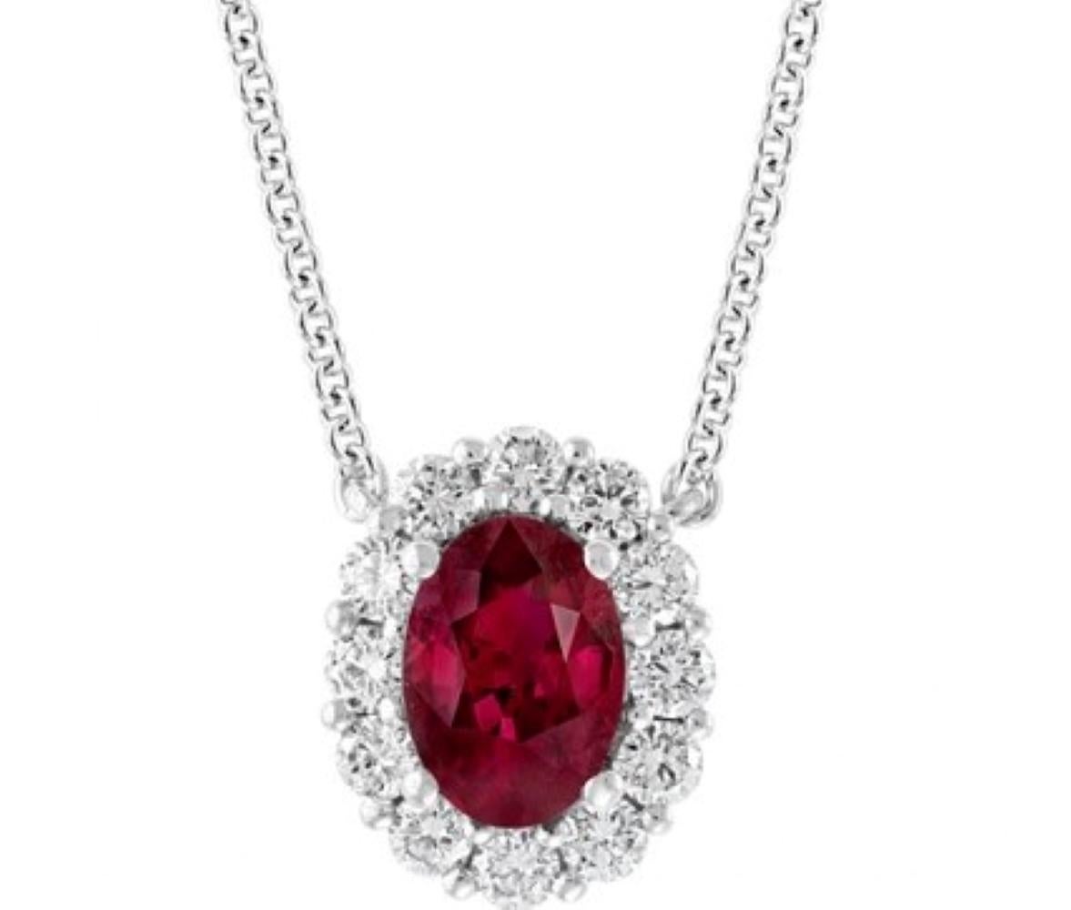 Modern Oval Brilliant Ruby Pendant Weighing .71ct with .48ct of Diamonds in 18kt White For Sale