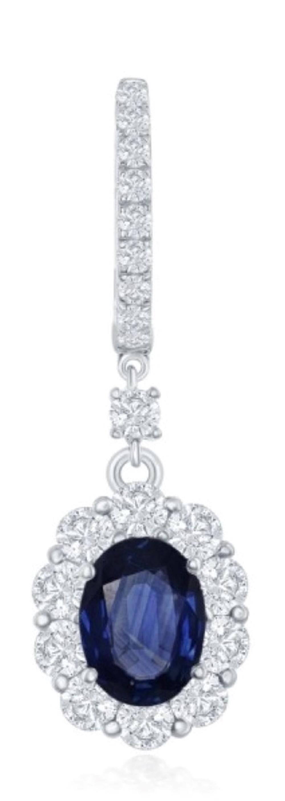 Beautiful drop style earrings articulate gently in the with light movement to throw brilliance and beauty in all directions. The two oval brilliant blue sapphires total 1.85ct and there are 1.74 ct of accenting round brilliant cut diamonds. These