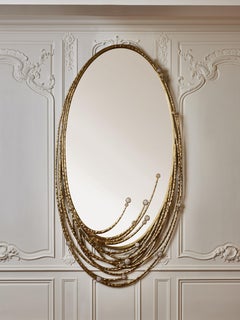 Oval bronze mirror by Studio Glustin