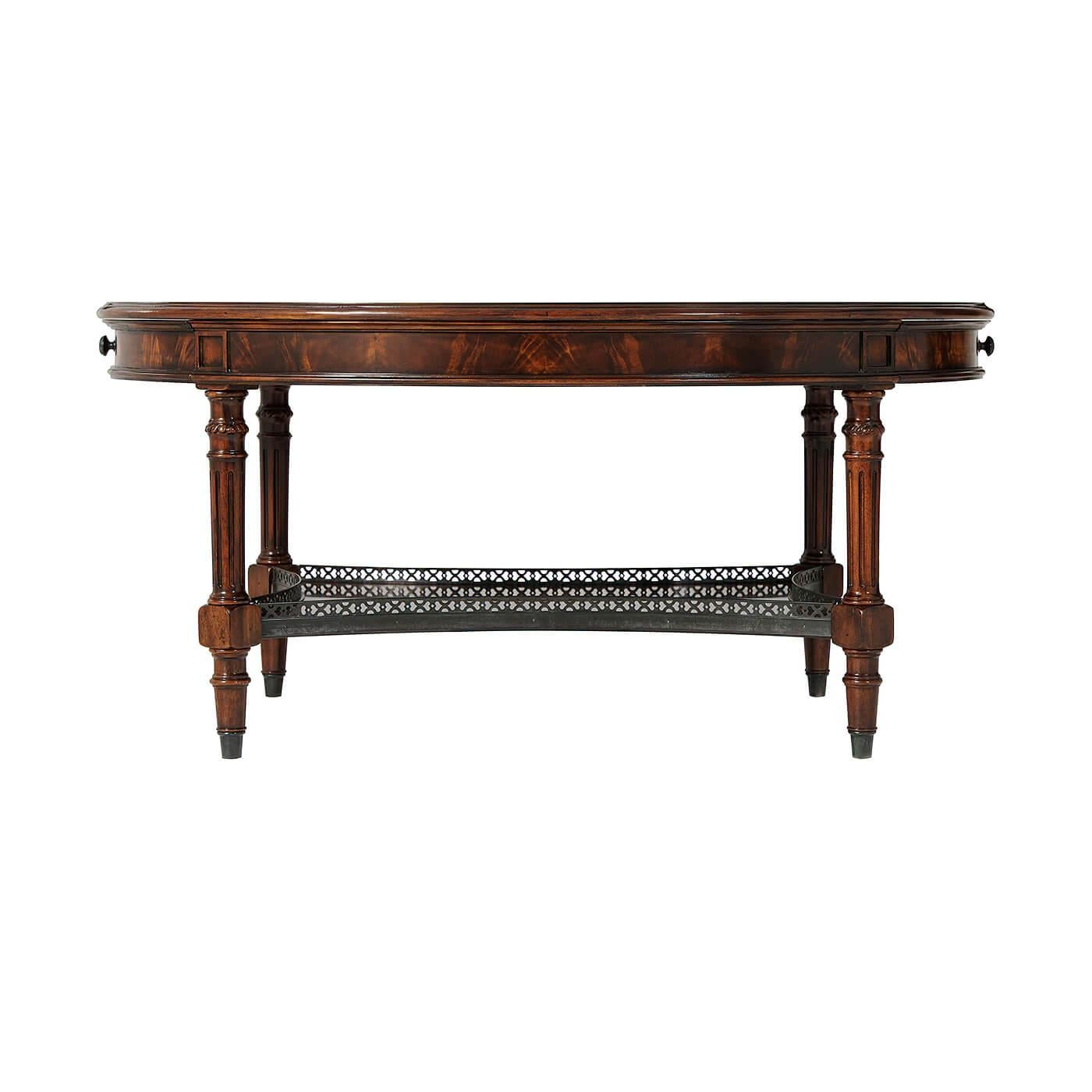 A Neoclassic style oval mahogany and burl veneer inlaid cocktail table, the oval top with two opposing end drawers, verdigris brass handles and a gallery to the concave undertier, on turned and fluted legs.

Dimensions: 42