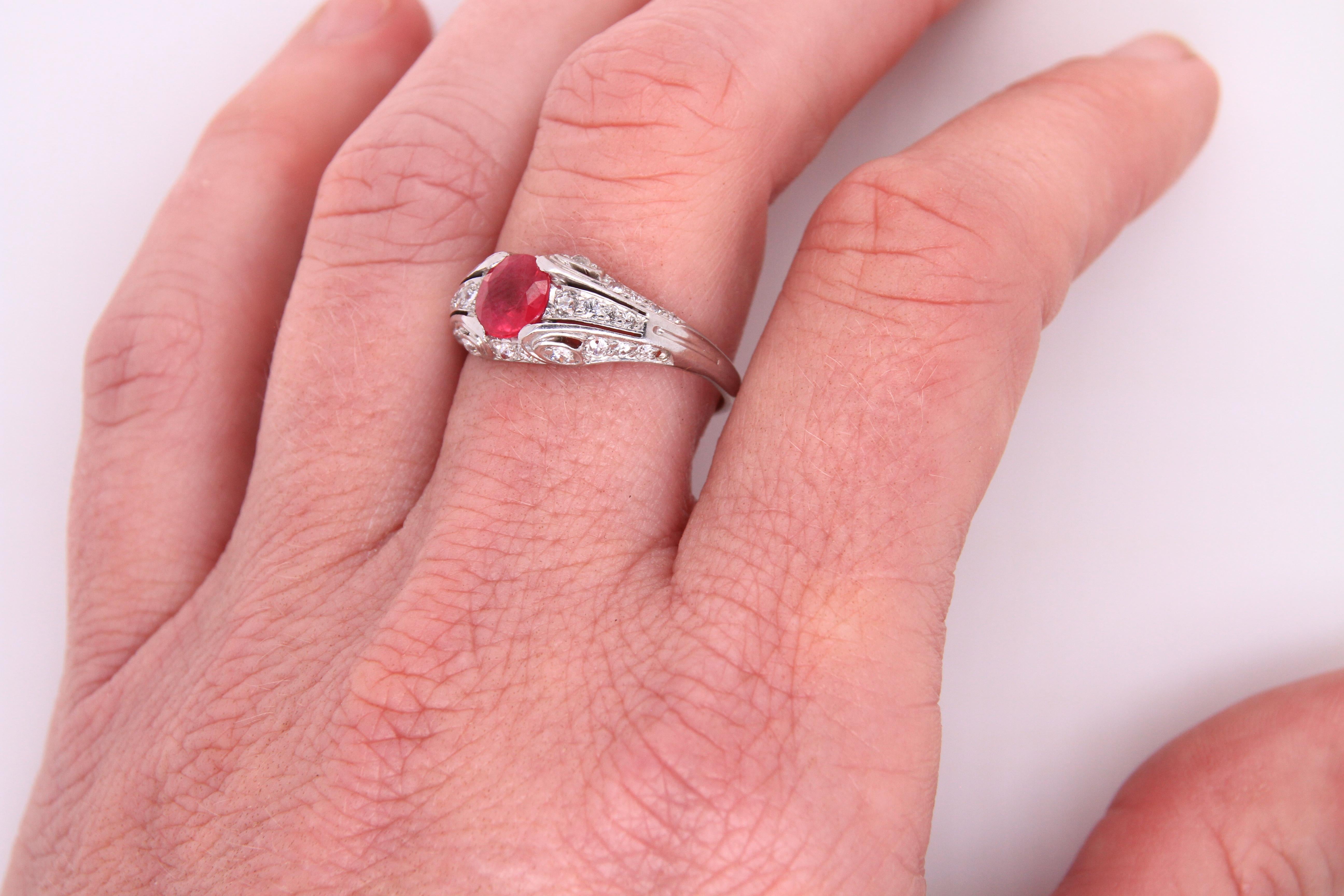 Oval Burmese Ruby and Diamond White Gold Bridal Engagement Ring, 14k white gold. 1 carat ruby with diamonds.
Weight: 4.7 grams
Size 8
Beautiful and delicate ruby and diamond ring, sure to be a stunner anywhere.