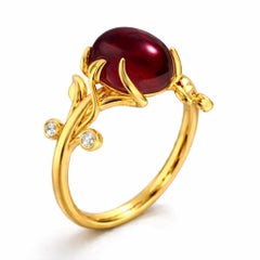 Oval cab garnet ring in 14k gold