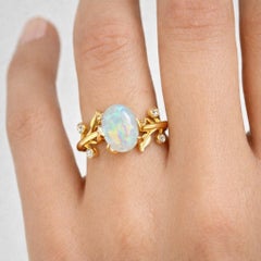 Oval cab opal ring in 14k gold