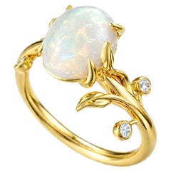 Oval cab opal ring in 14k gold