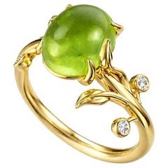 Oval cab peridot ring in 14k gold