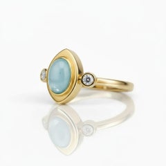 Oval cabochon aquamarine 14k gold ring