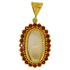 Retro Oval Cabochon Cut Moonstone and Ruby Cluster Style Pendant