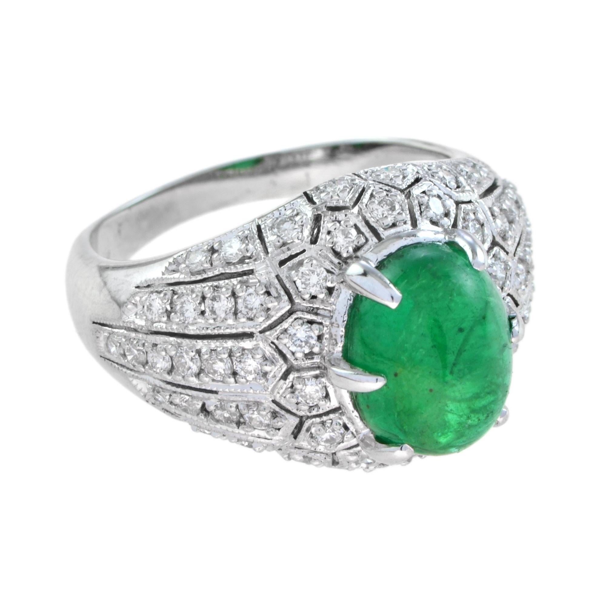 This emerald and diamond ring is a bold and scintillating statement. In the very center, an cabochon absinthe green emerald of incredibly vibrant hue sits perched above the shimmering diamond backdrop. Ready to wear from day to evening with style