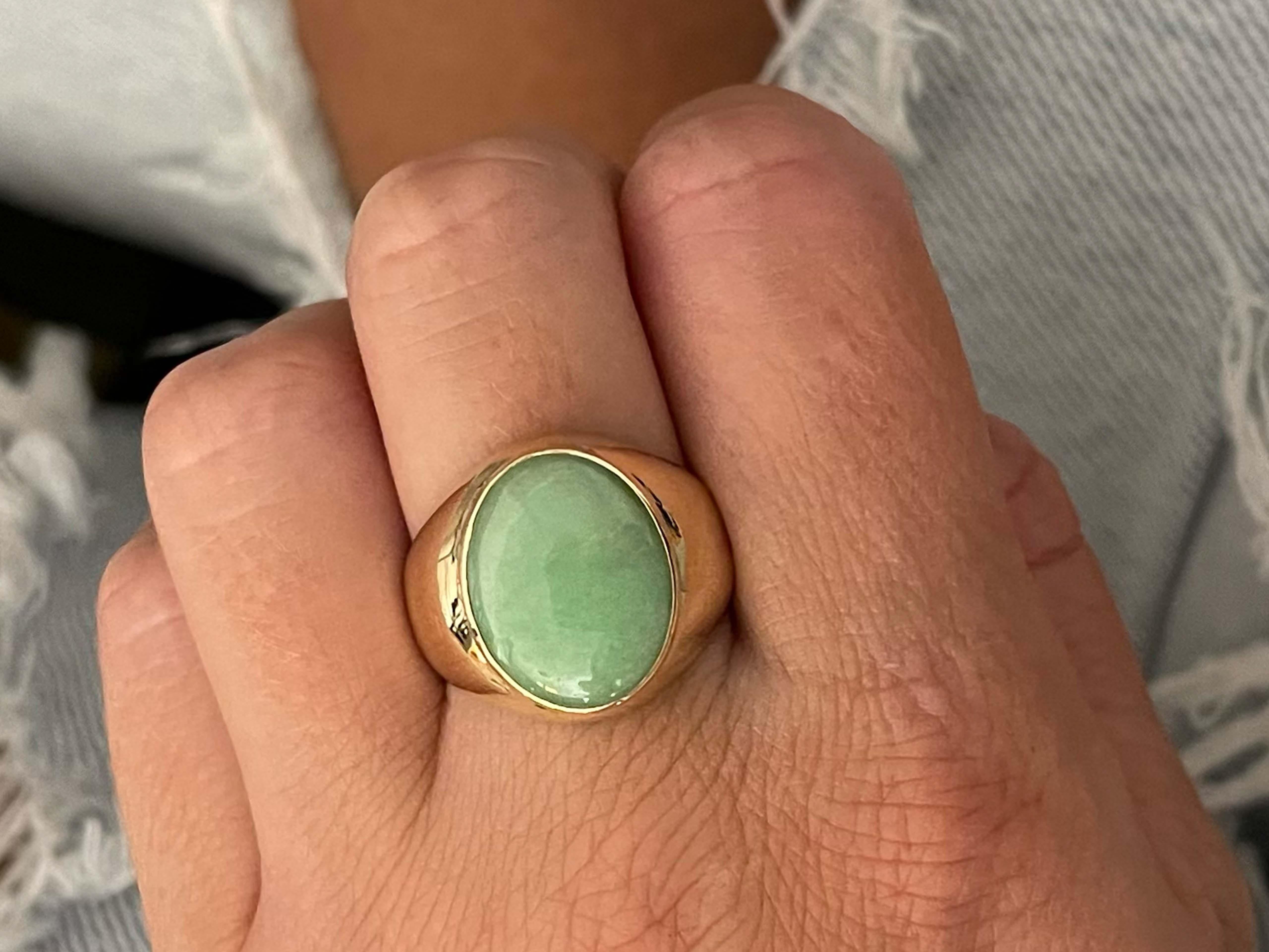 Item Specifications:

Metal: 14k Yellow Gold 

Style: Statement Ring

Ring Size: 9.25 (resizing available for a fee)

Total Weight: 6.8 Grams

Gemstone Specifications:

Center Gemstone: Jadeite Jade

Shape: Oval

Color: Green

Cut: Cabochon 

Jade