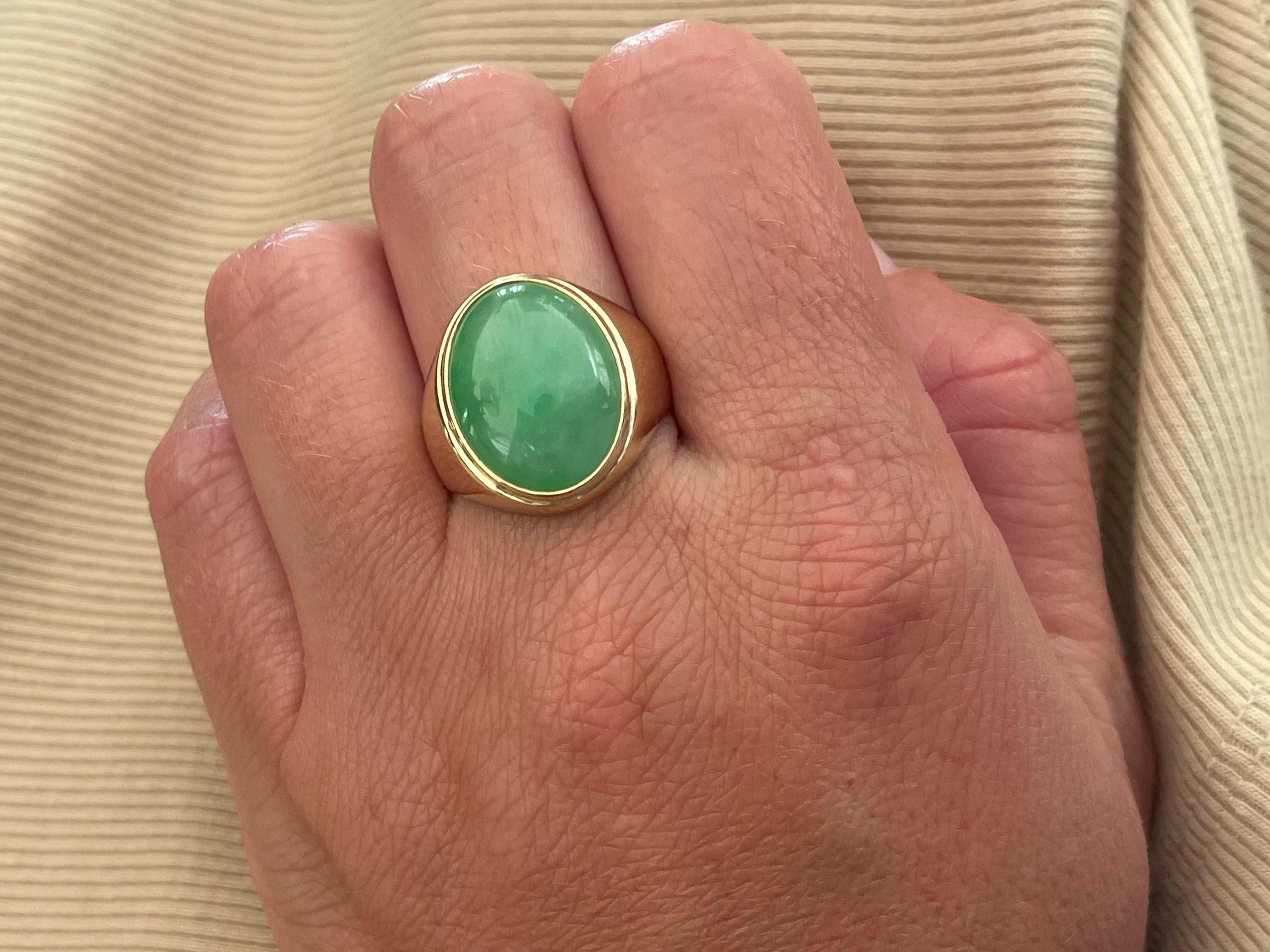Item Specifications:

Metal: 14k Yellow Gold 

Style: Statement Ring

Ring Size: 9 (resizing available for a fee)

Total Weight: 10.5 Grams

Gemstone Specifications:

Center Gemstone: Jadeite Jade

Shape: Oval

Color: Green

Cut: Cabochon

Jade