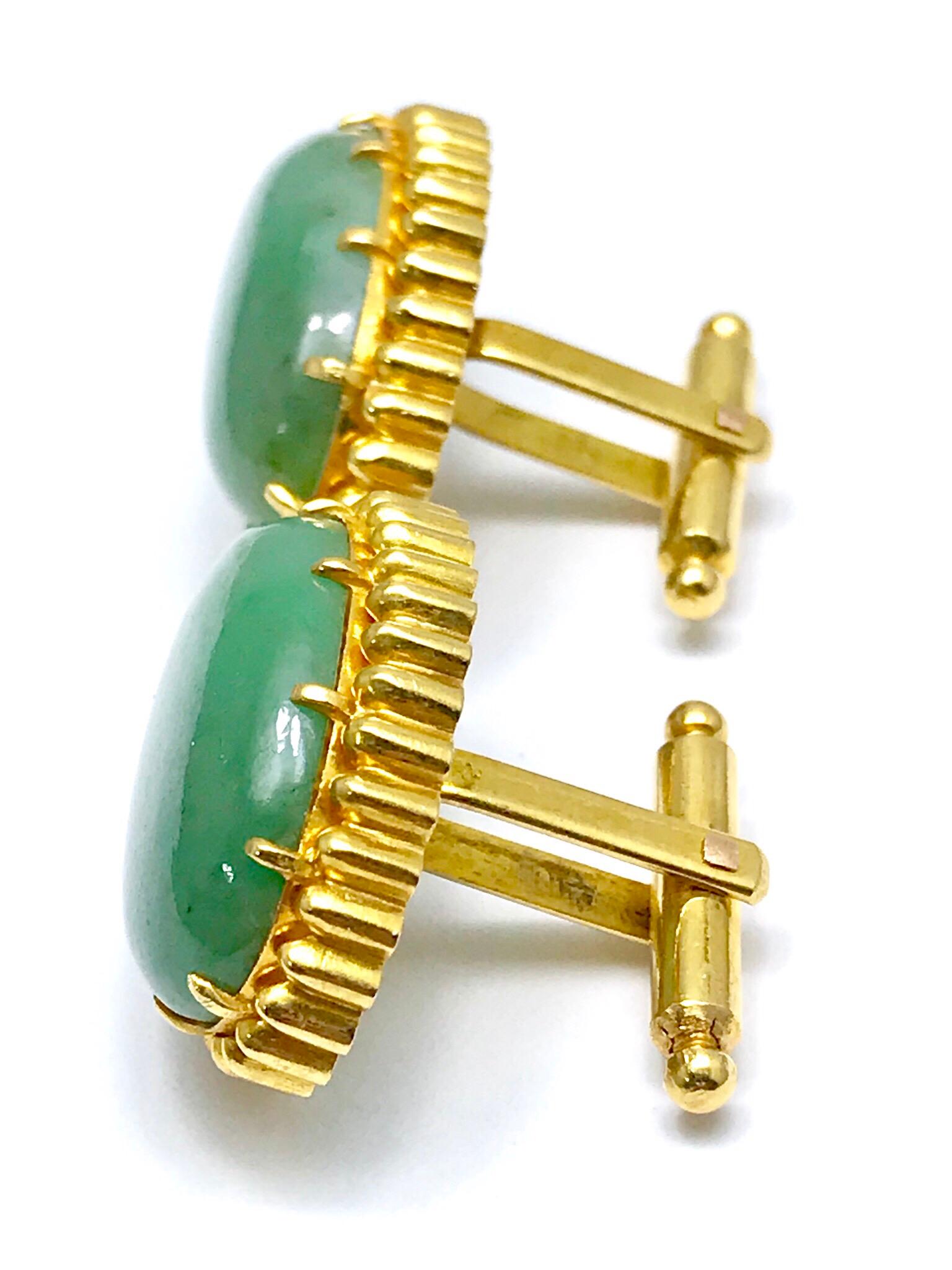 A fantastic pair of oval cabochon Jade and 18 karat yellow gold cufflink set.  Great for anyone and any occasion.  The Jade measures 20.80 x 13.50mm, and are prong set with a textured gold frame and a toggle back.  The matching stud set is