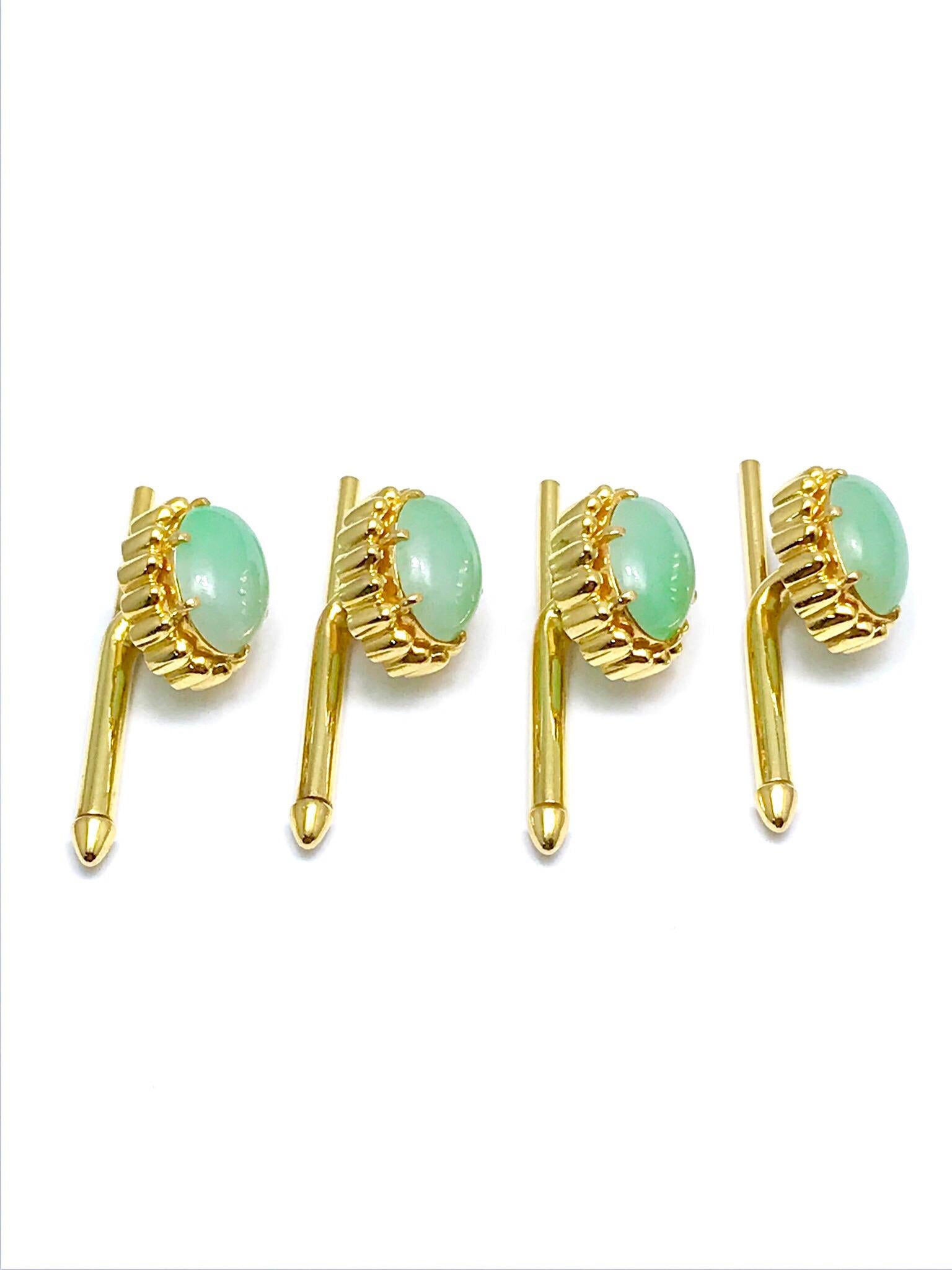A wonderful set of oval cabochon Jade and 18 karat yellow gold studs.  Great for anyone that has formal occasions throughout the year.   The Jade measure 10.70 x 8.00mm, set with six prongs each, with a textured gold frame, and spring loaded backs. 