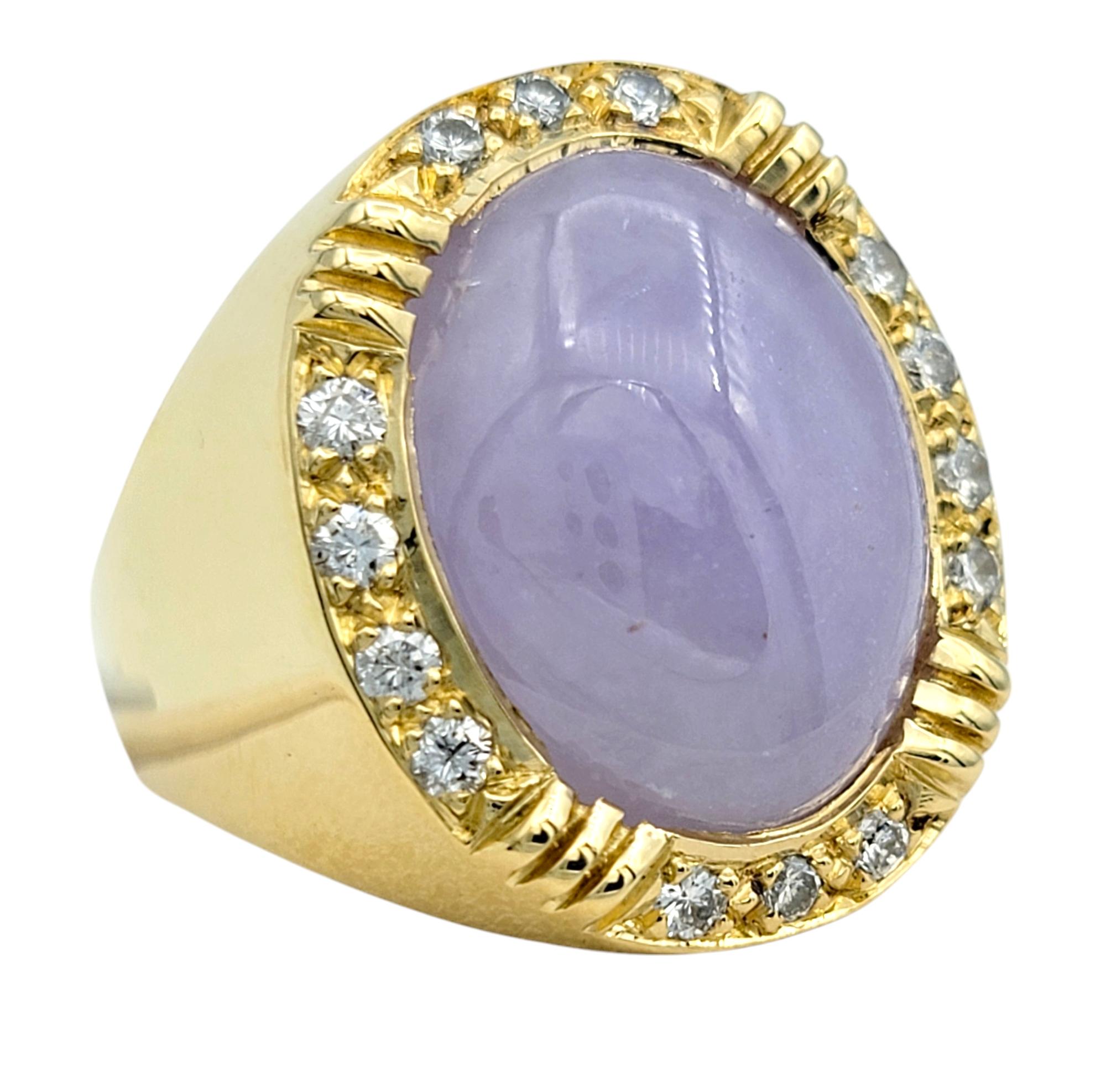 Ring Size: 6.75

This breathtaking jade and diamond ring is a true masterpiece, combining the mystical beauty of jade with the brilliance of diamonds. The center of this elegant ring features a large 10.33 carat cabochon oval-cut light purple