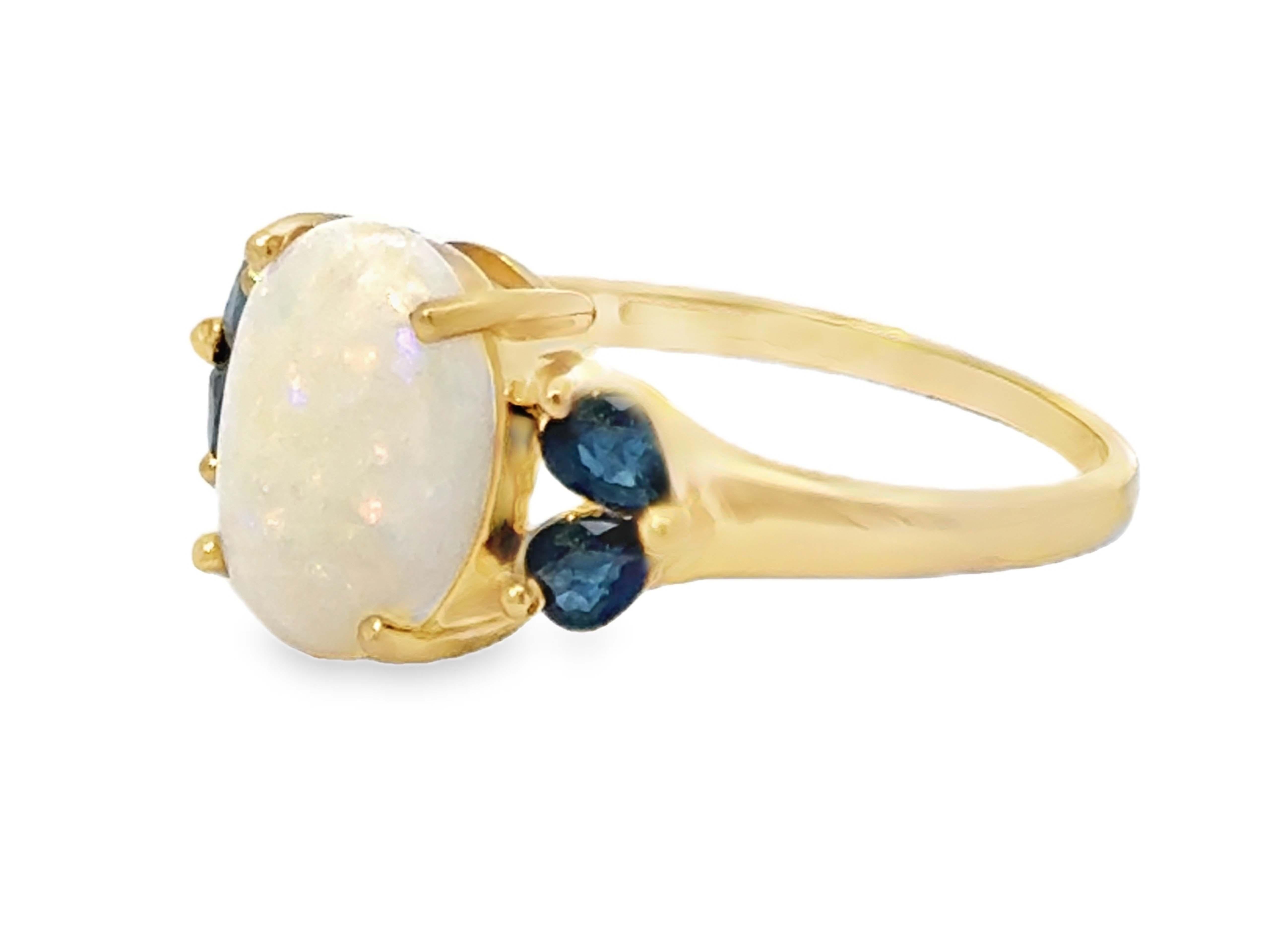 Oval Cabochon Opal and Pear Shaped Sapphires Ring 14k Yellow Gold In Excellent Condition For Sale In Honolulu, HI