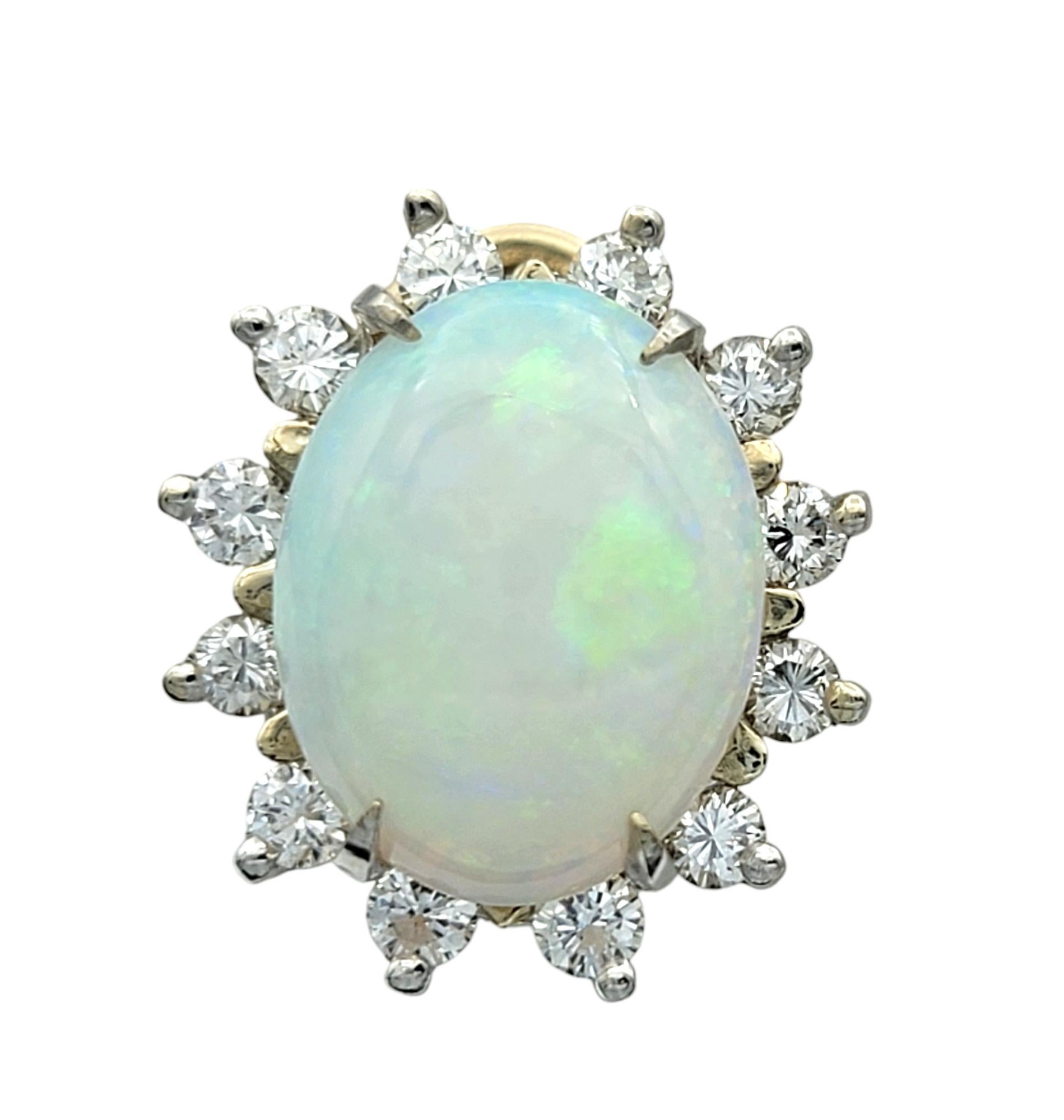 Embrace the ethereal beauty of these stunning cabochon white opal earrings, a true celebration of elegance and craftsmanship. Set in lustrous 14 karat white gold, each earring showcases a mesmerizing cabochon white opal at its center, its iridescent