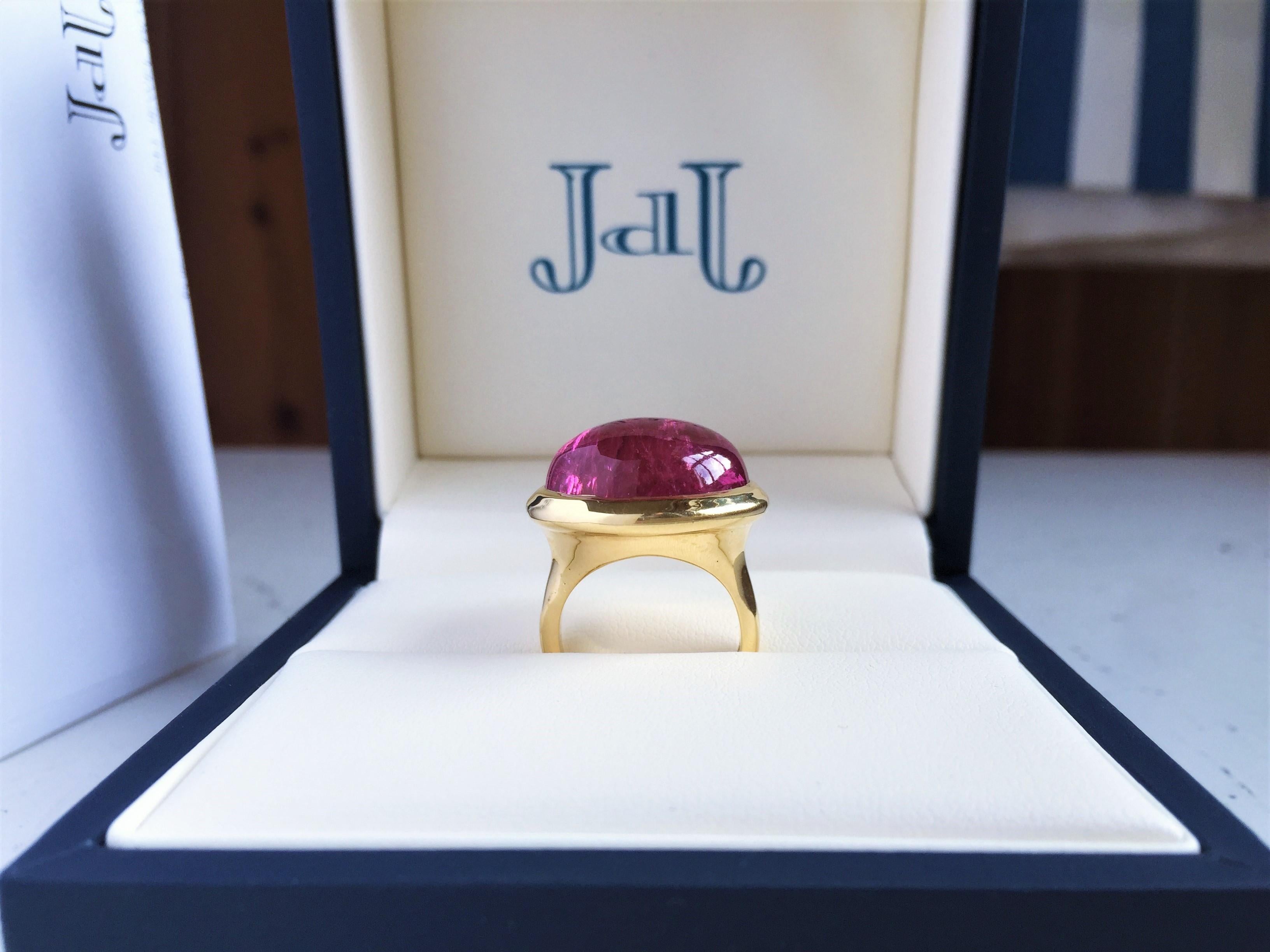 Lively Oval Cabochon Pink Tourmaline ring in 18k yellow gold set with impressive Oval Pink Tourmaline Cabochon weighing 27.15cts -  Bezel set in 18k yellow gold mount - size 6 


