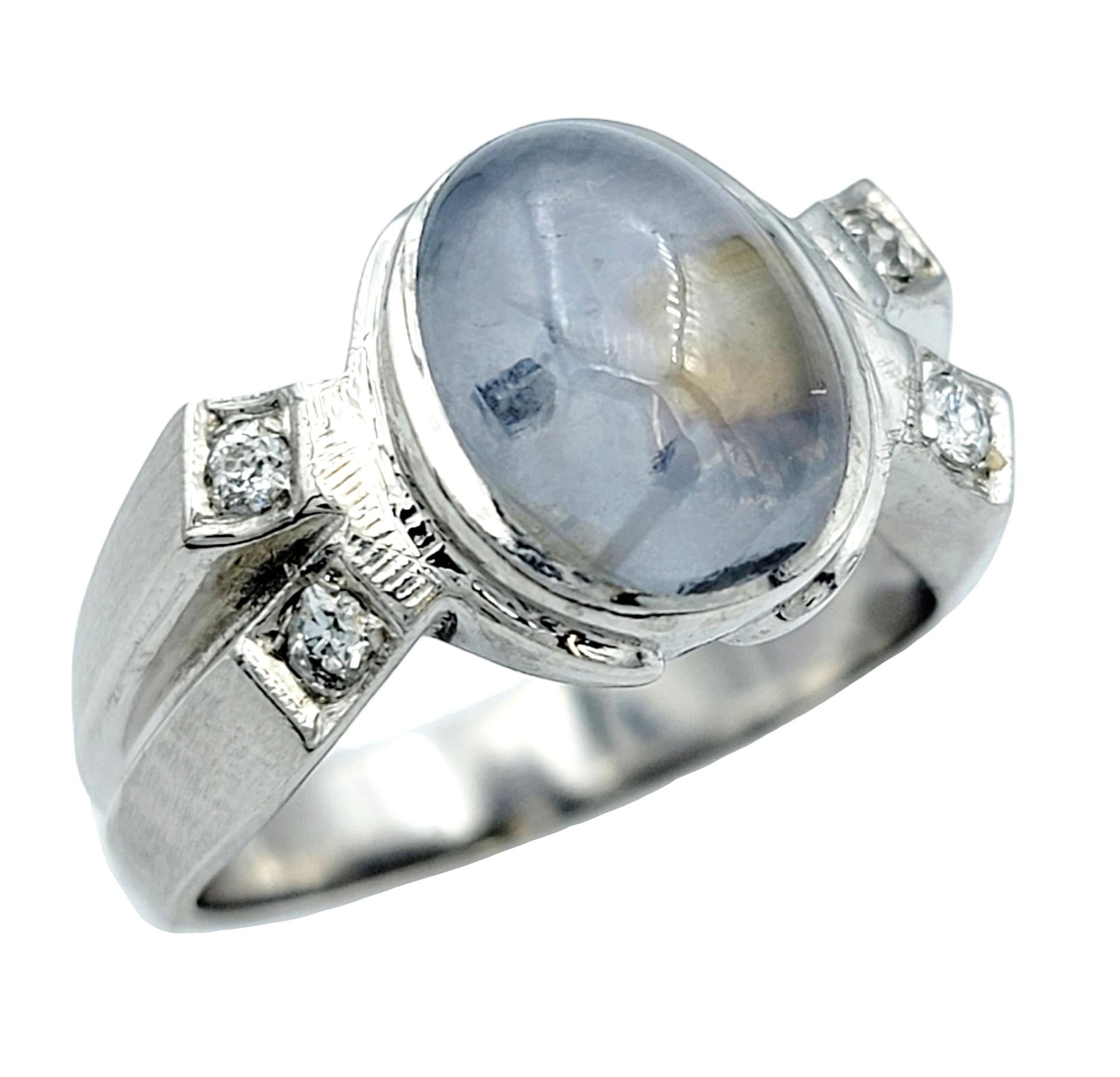 Contemporary Oval Cabochon Star Sapphire and Diamond Cocktail Ring in 14 Karat White Gold For Sale