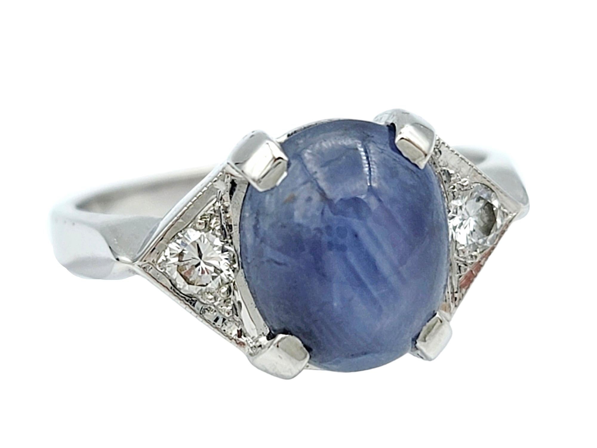 Contemporary Oval Cabochon Star Sapphire and Diamond Cocktail Ring Set in 14 Karat White Gold For Sale