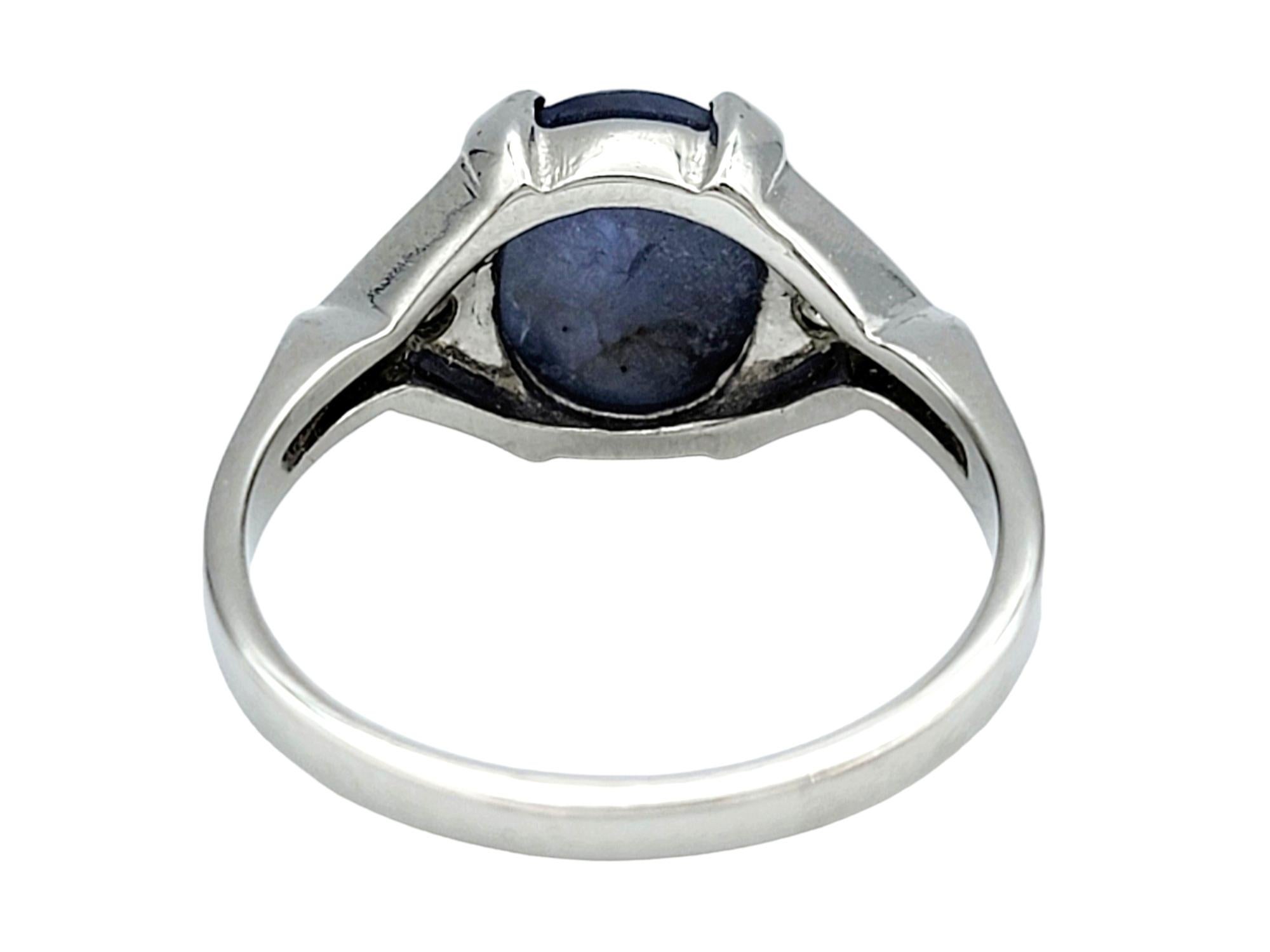 Women's Oval Cabochon Star Sapphire and Diamond Cocktail Ring Set in 14 Karat White Gold For Sale