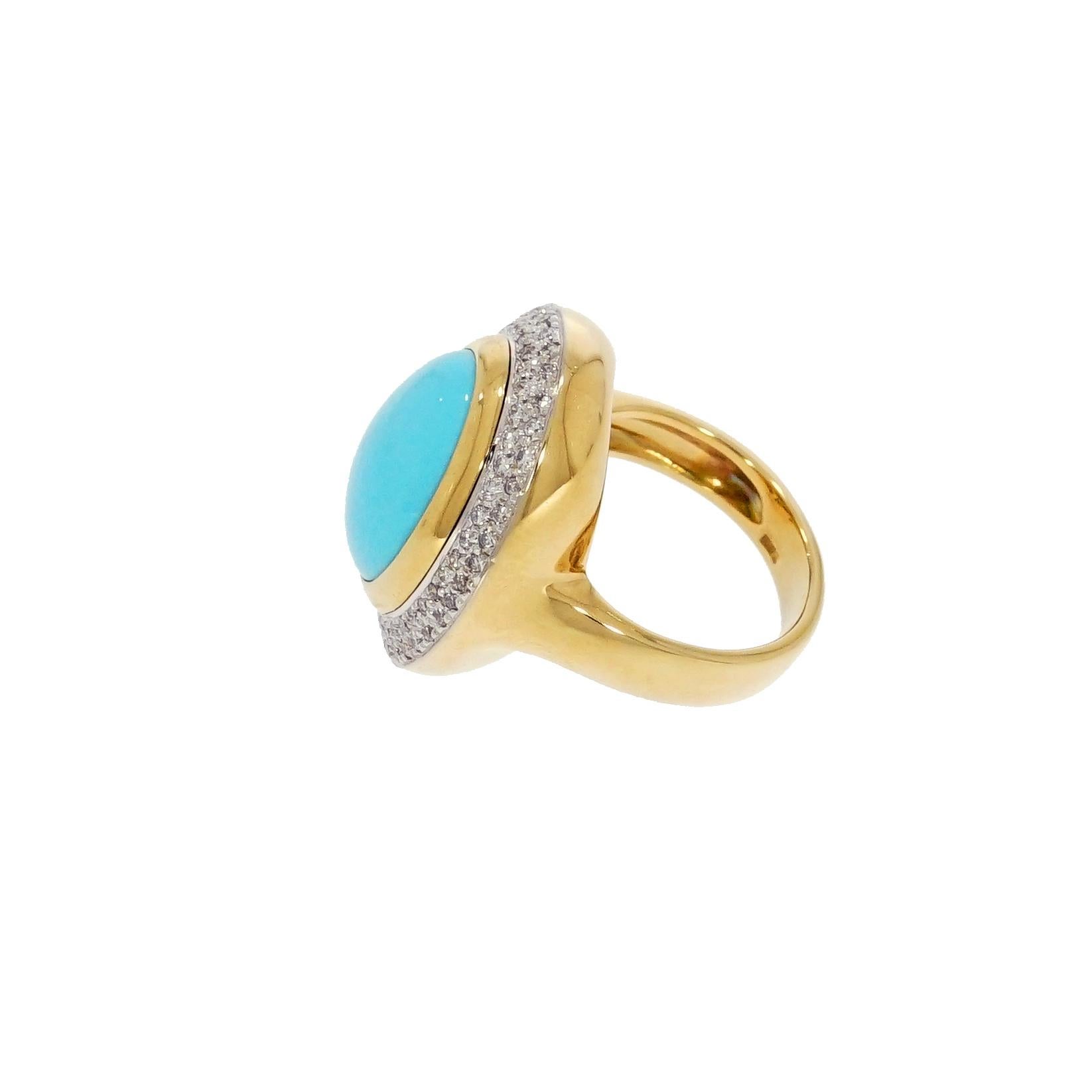 This alluring turquoise ring is centered with an oval cabochon-cut turquoise measuring 16x13mm, framed by a double row of pave-set round brilliant cut diamonds, weighing approx. 1.00 carats, the width of the band is 4.5mm.
The ring is in great