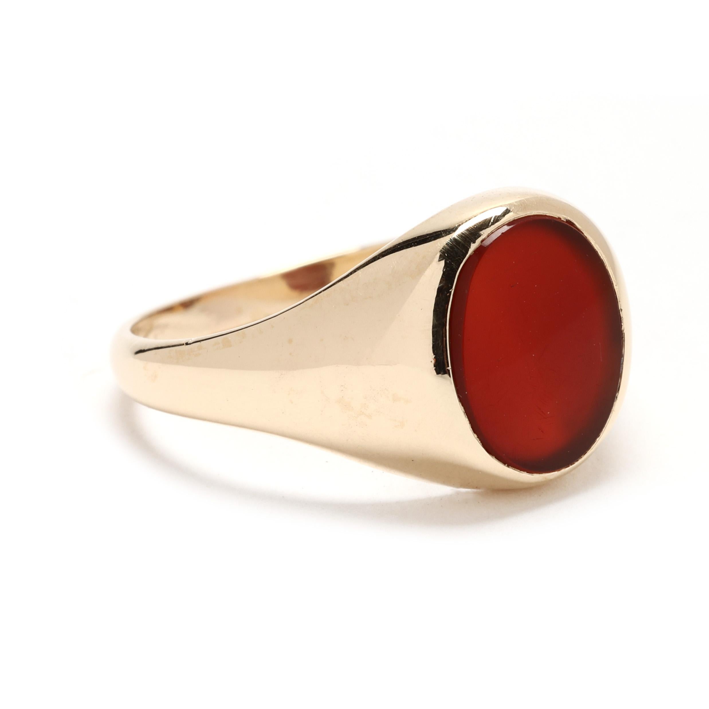 Make a bold and timeless statement with this elegant oval carnelian signet ring, set in luxurious 14k yellow gold. Featuring a rich, fiery orange carnelian gemstone, this classic signet ring exudes strength and sophistication, perfect for those who