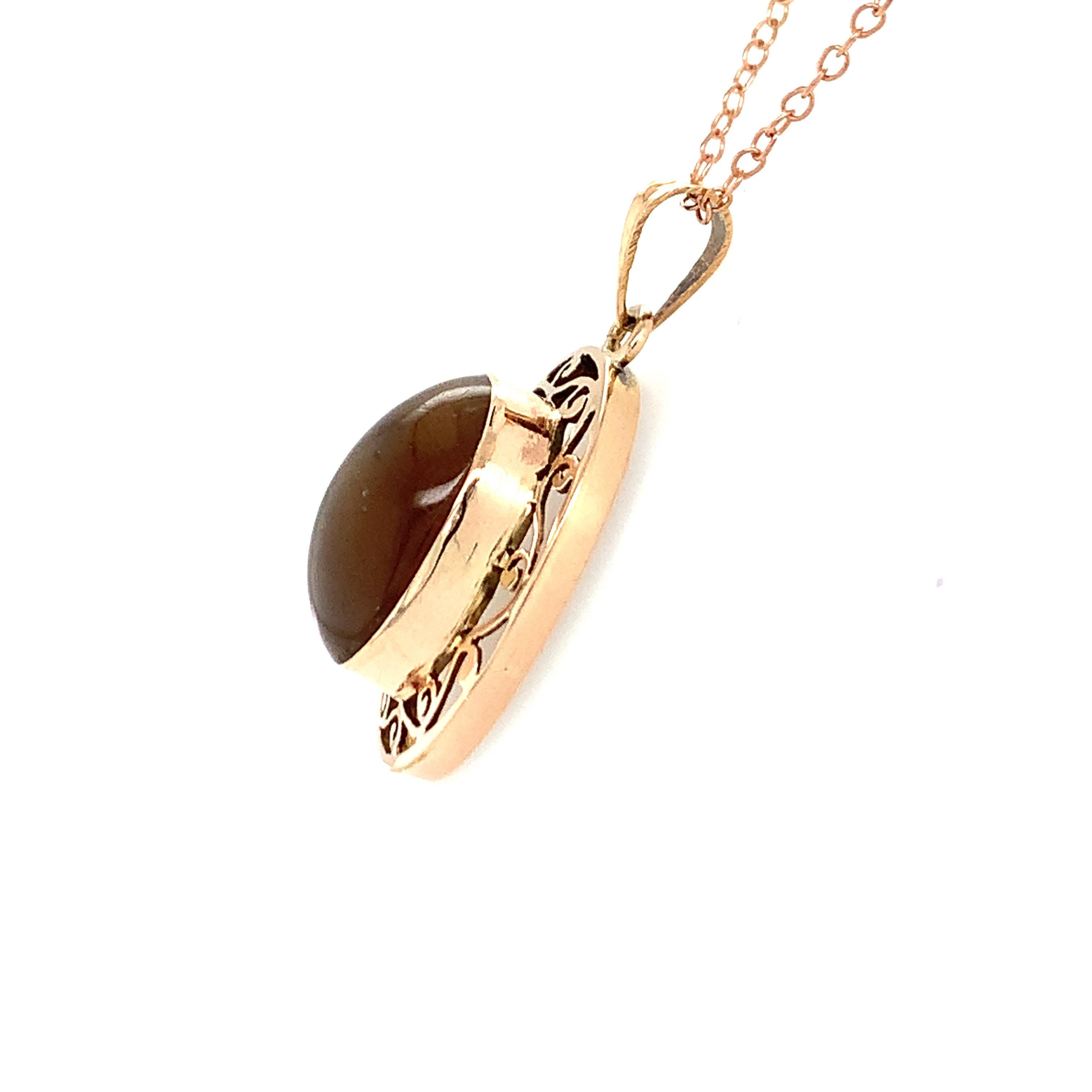 Hand cut and polished honey colored natural cat's eye is crafted with hand in 14K yellow gold. 
Ideal for daily casual wear.
Chain is not included. 
Image is enlarged to get a closer view.
Ethically sourced natural gem stone.