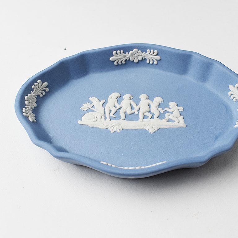 Every woman needs a special place to hold her rings when unworn. This pretty blue unglazed jasperware oval ring dish is the perfect place. Oval in shape, it has scalloped edges on the corners. It has a raised rim, to hold it’s contents in place.