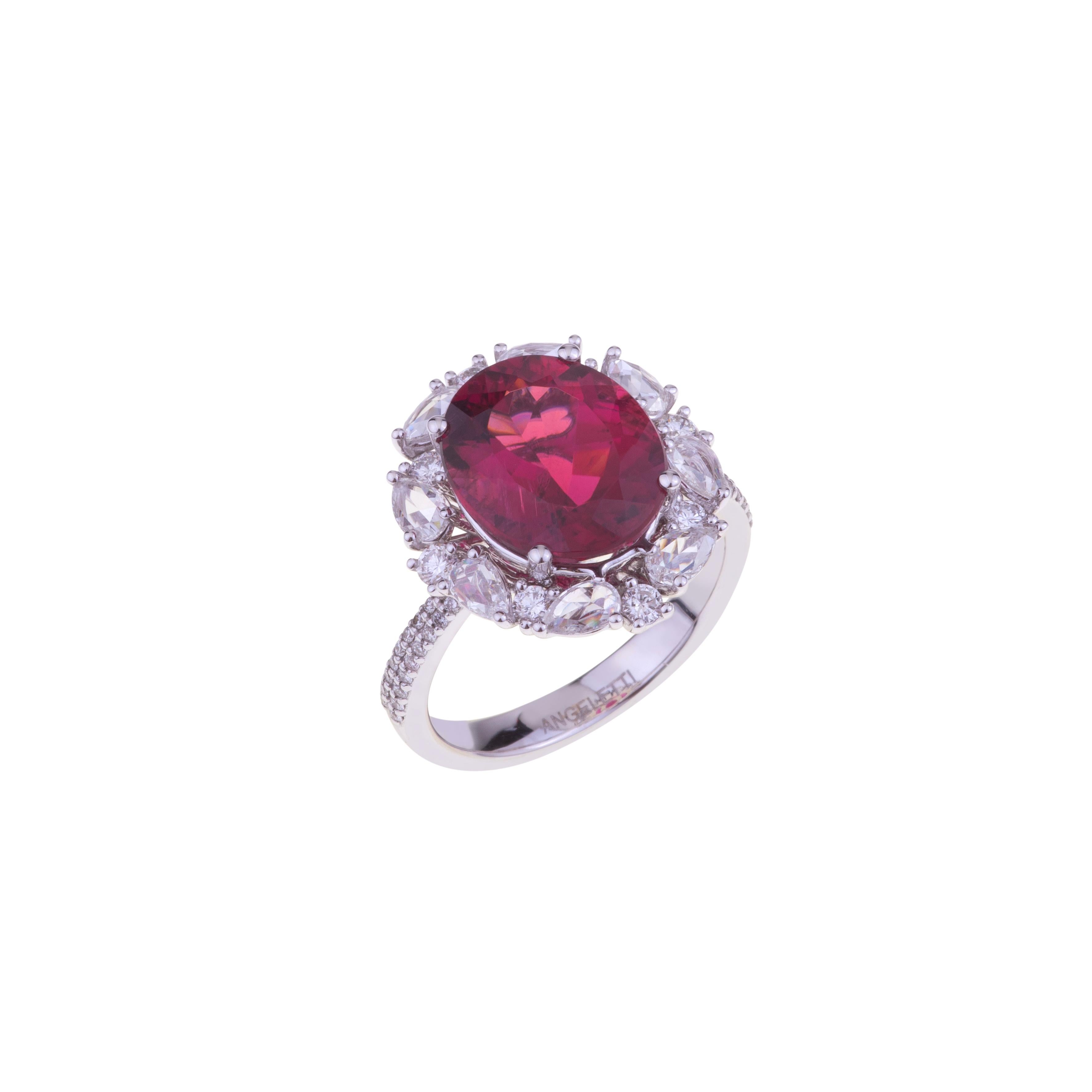 Oval Certified Rubellite Ring White Gold with Diamonds.
The Ring is Dominated by an Exceptional Rose Red Rubellite ct. 4.99 (with Certificate) and is set with White Gold and Pear Shape Rose cut Diamonds ct. 2.48 VVS. The weight of the 18kt gold is