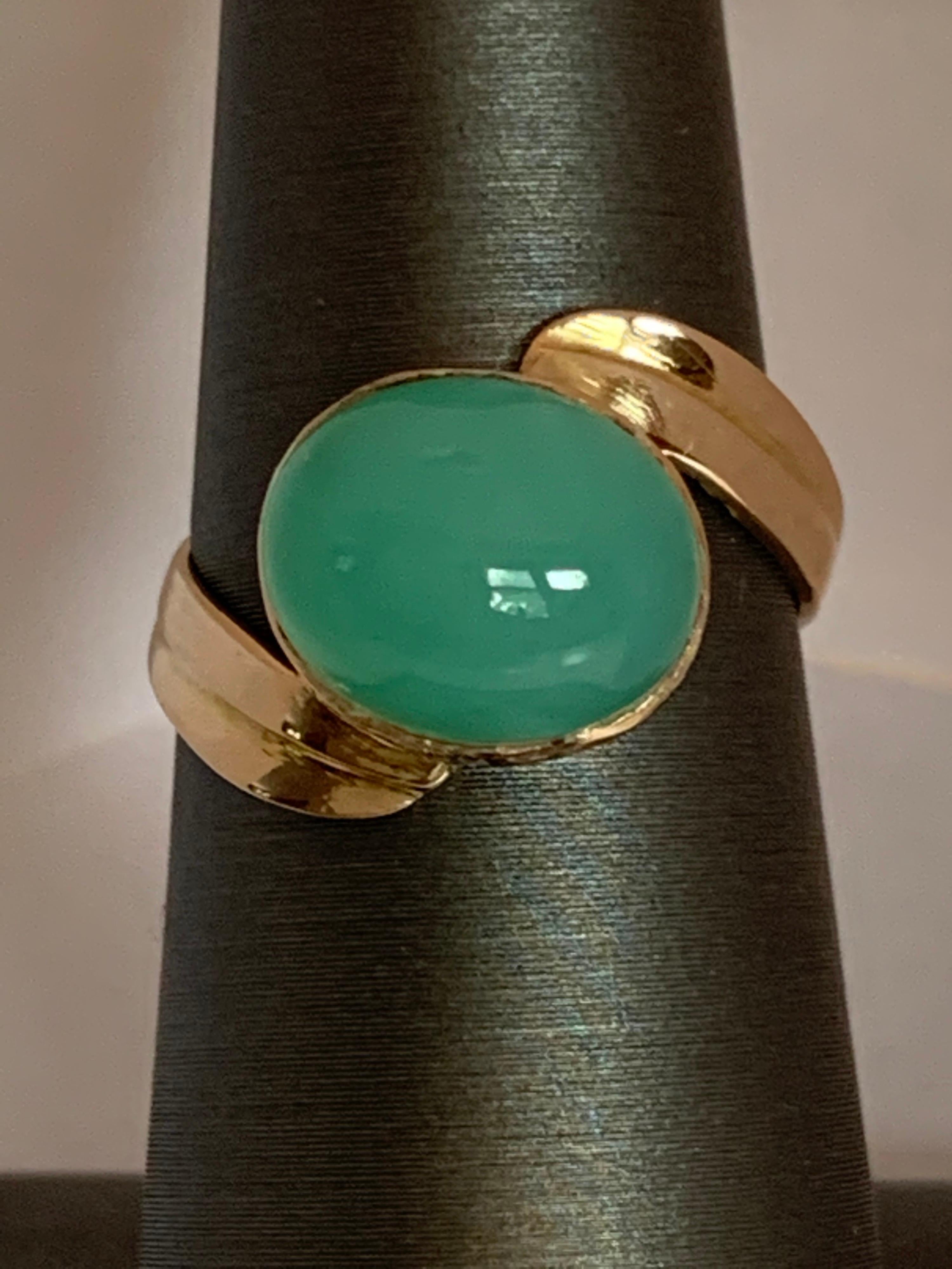 Beautiful Oval Chrysoprase set in 14 Karat Yellow gold is handcrafted size able 7 ring. The Ring is one of a kind and approx weight of the stone is 6 carat and measures 8mm X 10mm 
