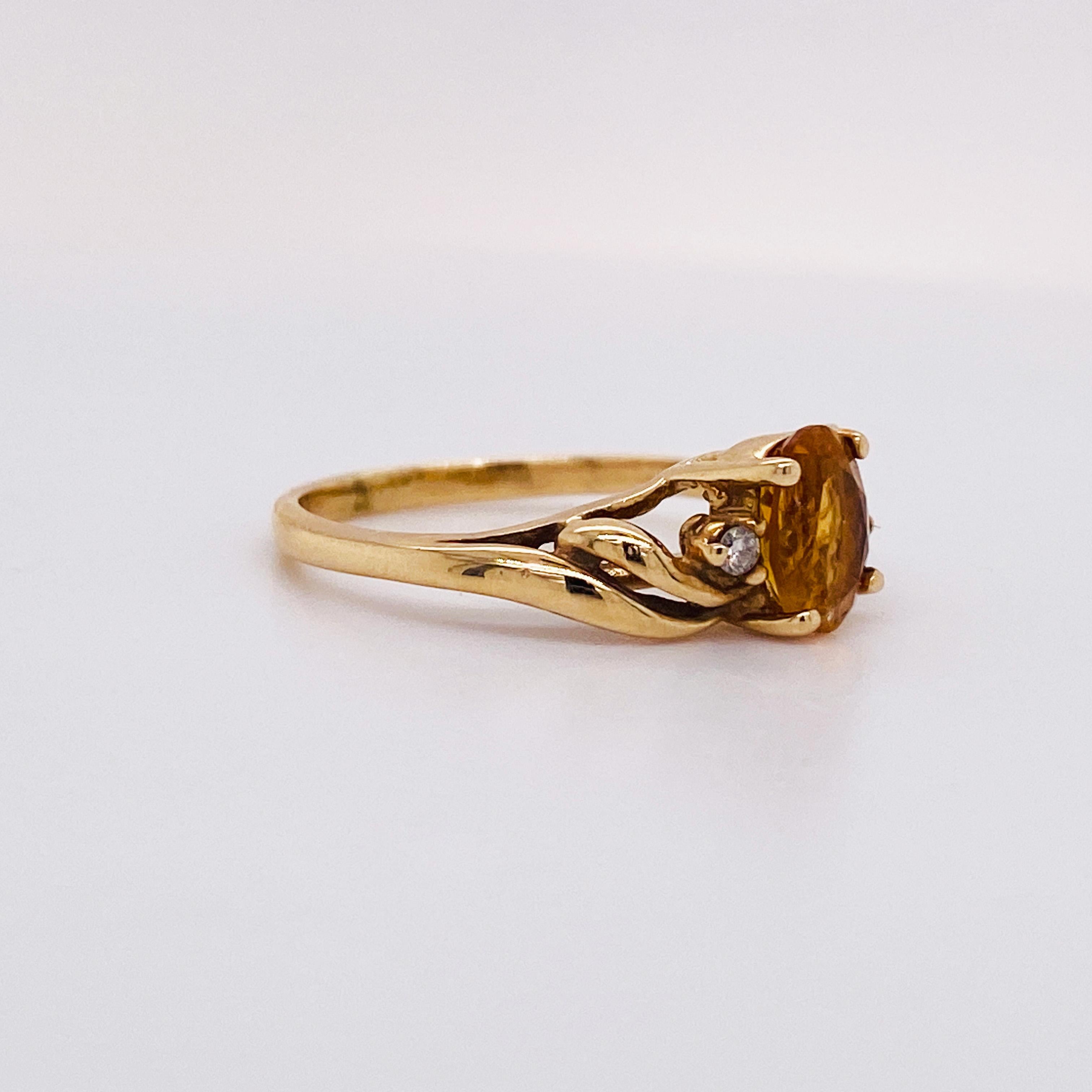 Celebrate your November loved one with this sweeping and swirling citrine and diamond ring. This could make a perfect graduation gift or push present! The oval citrine is the color of a glorious warm orange sunset! This beauty is marked down from