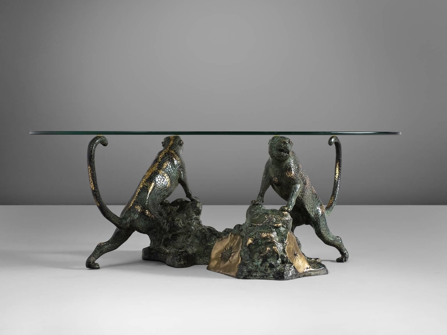 Coffee table, cast bronze panthers and glass, Belgium, 1960s.

This highly rare cocktail table shows two beautifully detailed small panthers, standing upwards against a rock. The table has a very strong appearance, the position of the two animals