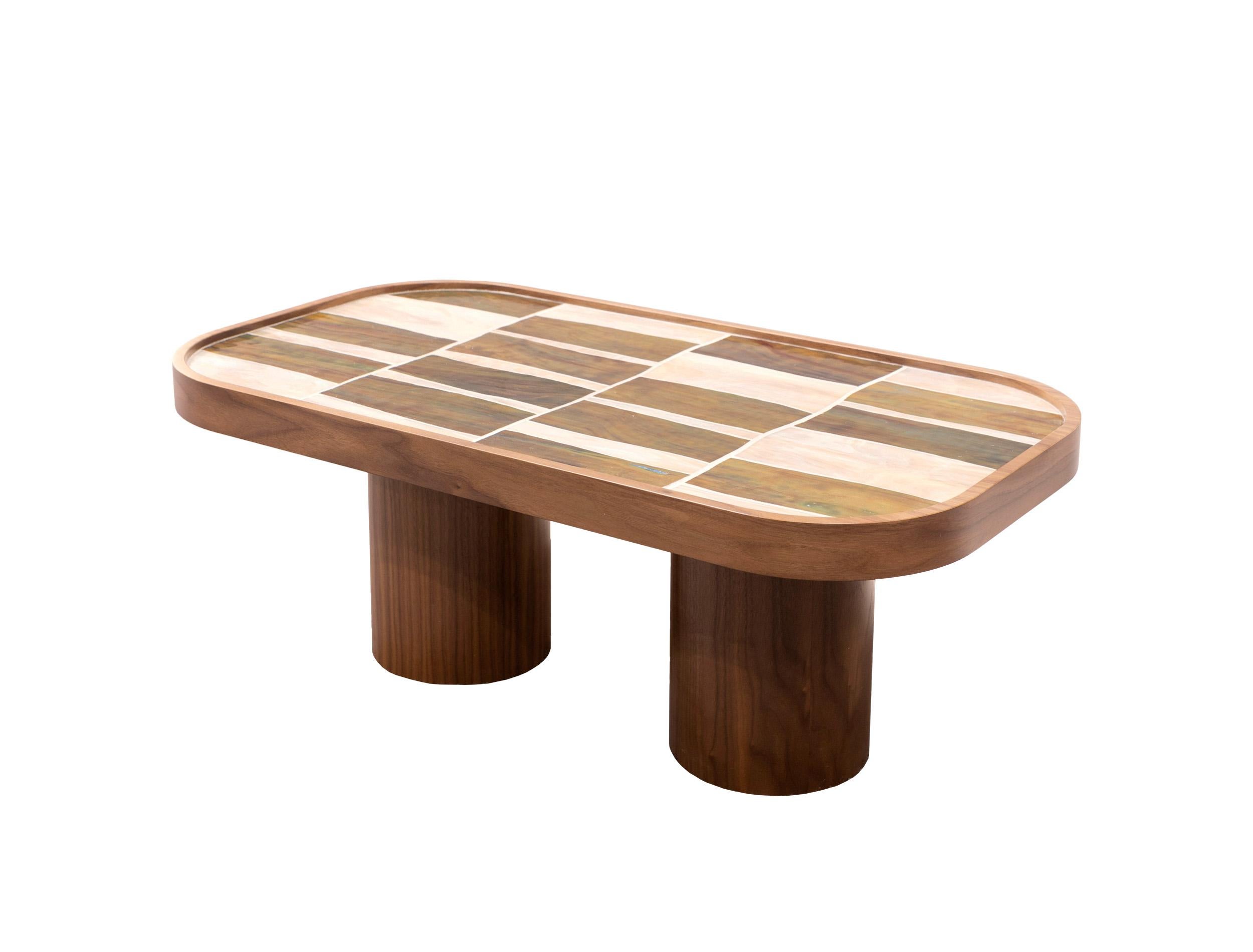 Palazzo oval coffee table with green and ivory Japaneese glass sits on 4 Walnut Wood pedestal by Ercole Home. This new bespoke coffee table design by Ercole Home is available today for your living space.
A sleek table with high craftsmanship and