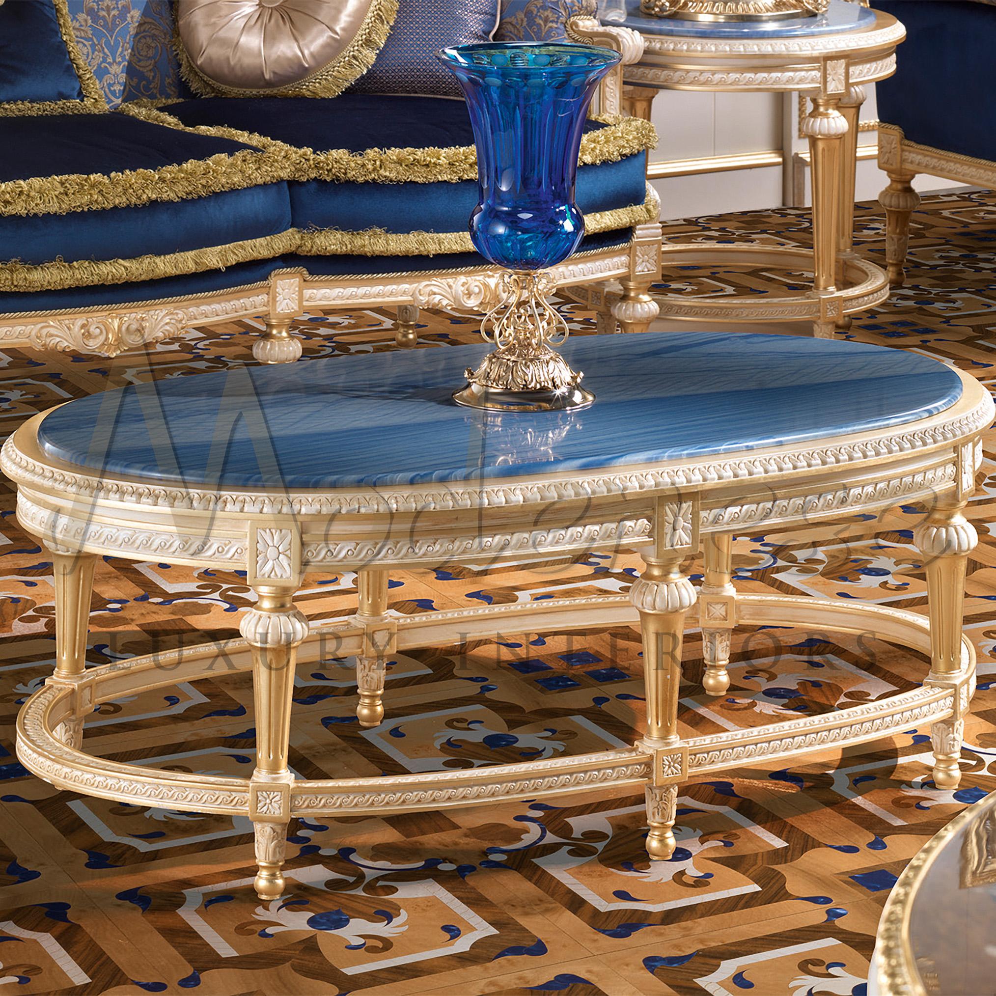 Modenese artisans knowledge of gold leaf applications goes beyond imagination. The true essence of their work is shown through this magnificent oval coffee table, that catches the eye with its tasteful combination of Azul Macaubas marble and shining