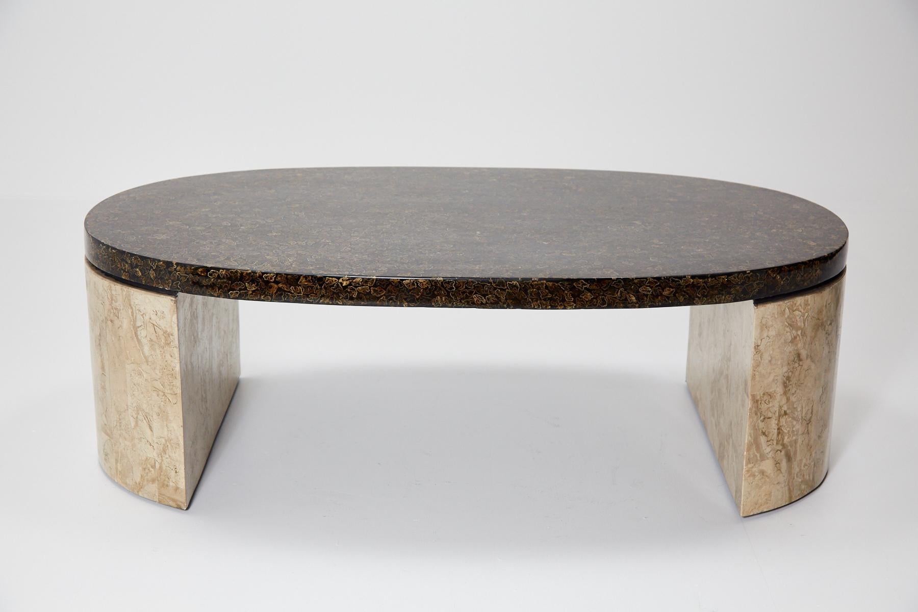 Contemporary lacquered coffee table comprised of an oval tabletop with fern tassel inlay finish and tessellated cantor stone legs. Fiberglass body.

All furnishings are made from 100% natural materials, carefully hand cut and crafted piece-by-piece