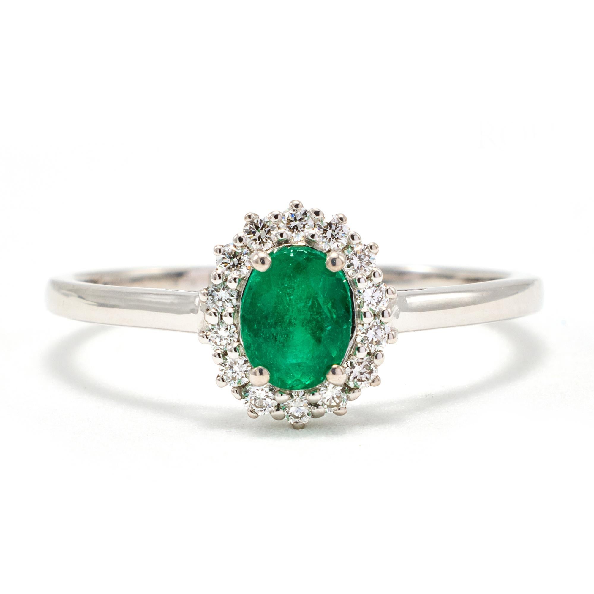 Genuine, natural Colombian Emerald Oval surrounded by Natural Diamonds set in 18k White Gold. Emerald Weight: 0.41 ct
Diamond Weight : 0.15ct. This natural Colombian emerald ring is a great fashion ring. Excellent for daily wear and versatile. The