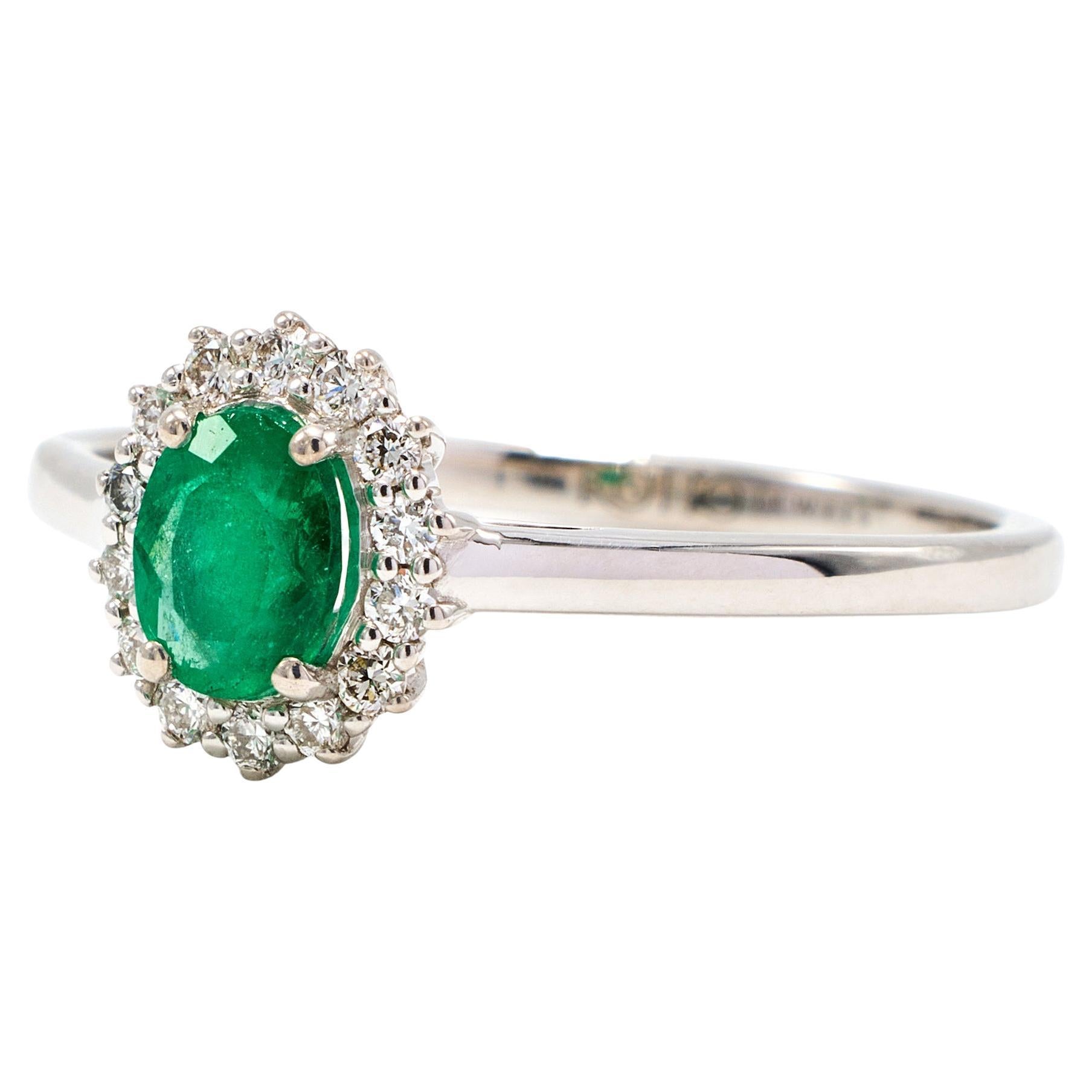 Oval Colombian Emerald Ring with Diamonds Around Set in 18k White Gold For Sale