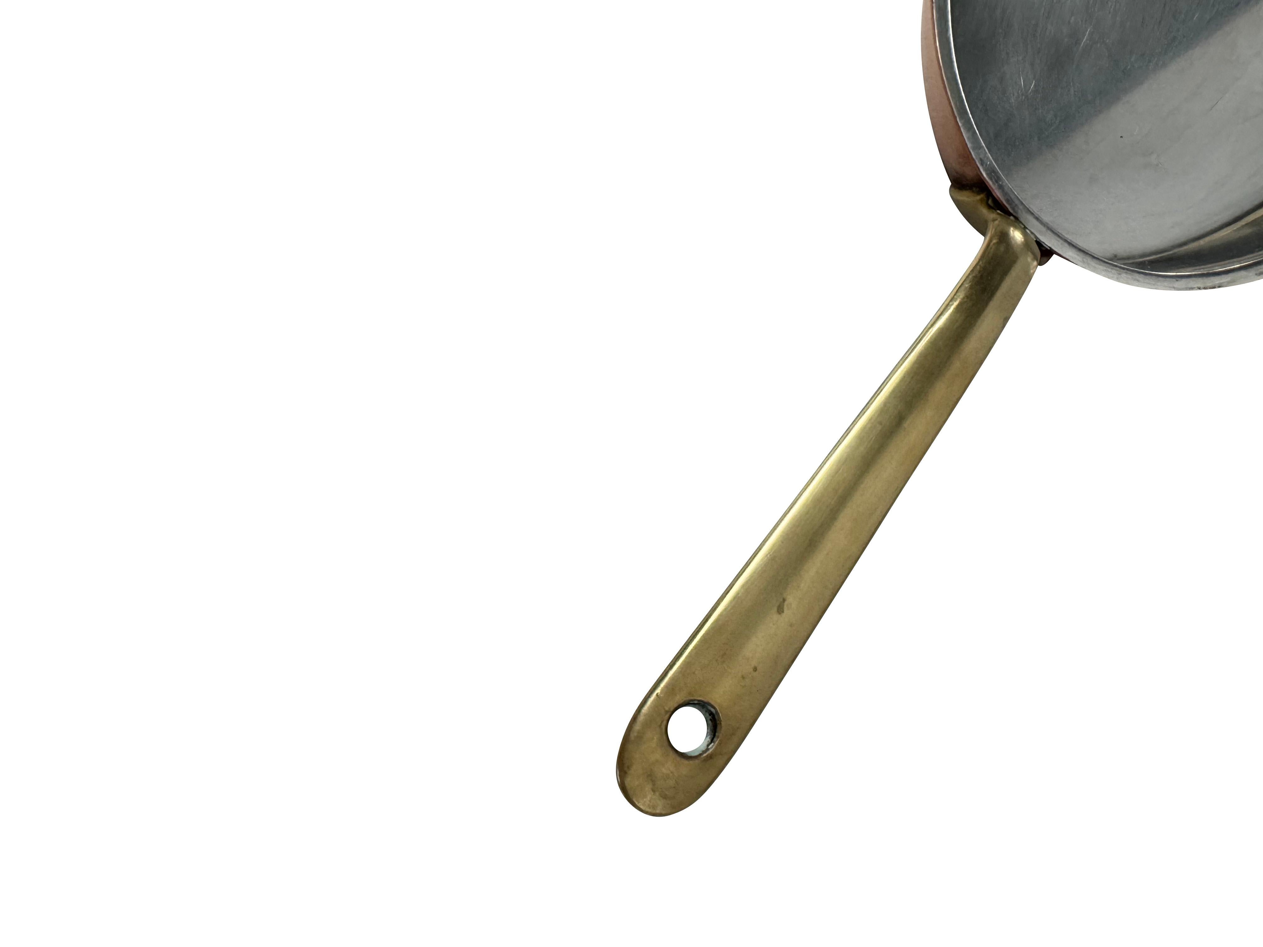 A  tin-lined copper fish or gratin pan from around the 1970s/1960s.

This classic fish or gratin pan has a bronze handle which is short and ideal for cooking under a grill or oven - it is solid, secured by two copper rivets and has light patina