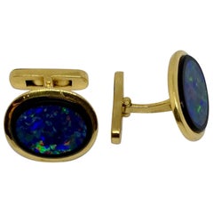 Vintage Oval Cufflinks with Opal and Black Onyx Set in 18 Karat Yellow Gold