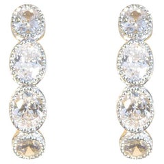 Créoles huggies en or 18 carats avec diamants taille ovale de 0,70 carat