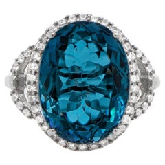 Oval Cut 12 Carat London Blue Topaz Ring with White Topaz Halo Silver