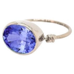 Oval Cut 3.85ct Tanzanite in Love Knot Style Ring in 18ct White Gold