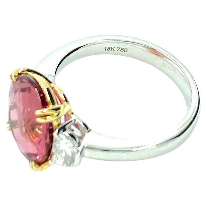 Contemporary Oval Cut 4.47 Carat Pink Tourmaline Diamond Three-Stone Ring in 18 Karat Gold For Sale