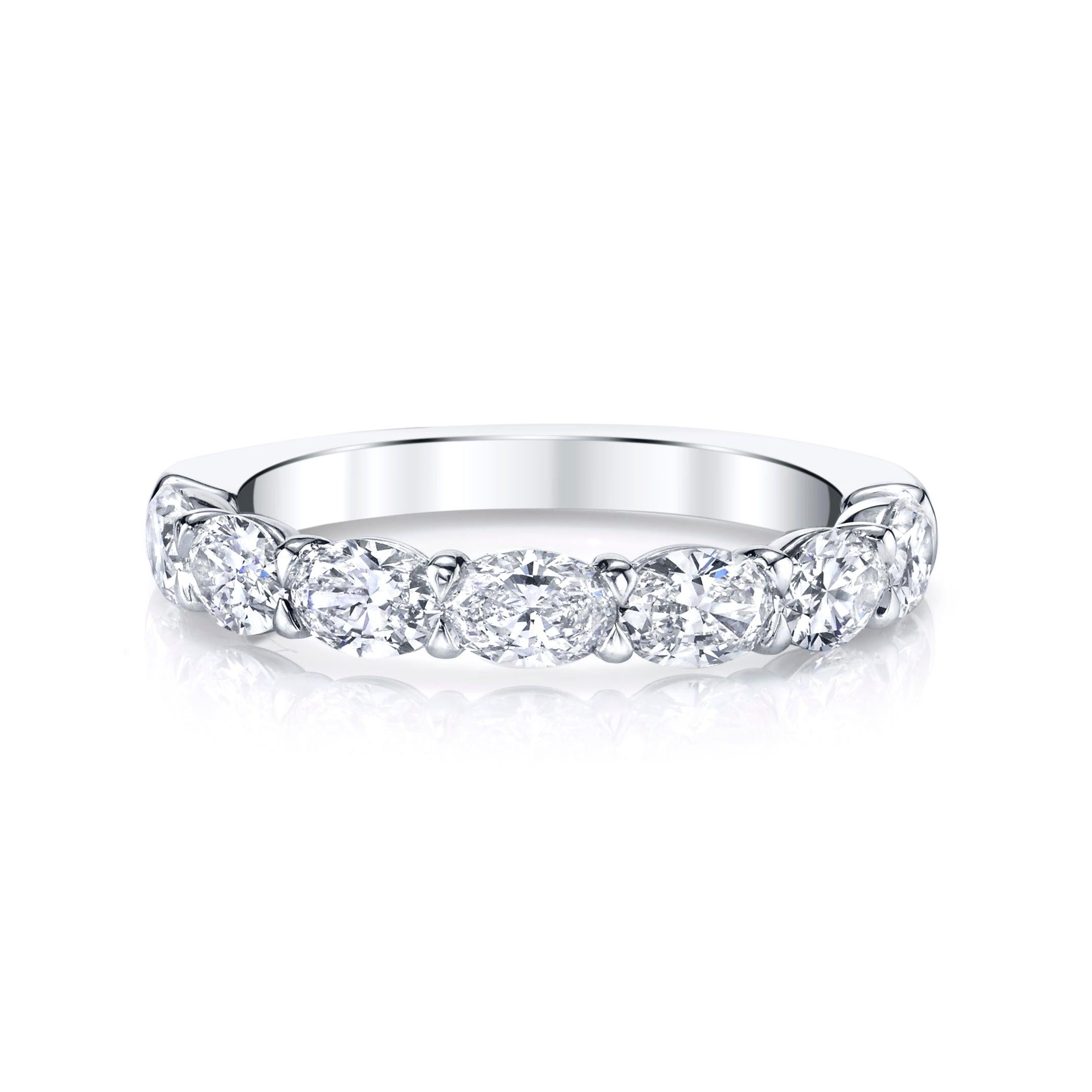 
This exquisite eternity band flaunts seven horizontally set dazzling oval-cut diamonds.
It is crafted from platinum, this ring is currently a size 6.

Oval Diamond Cut Eternity Band.
Diamonds: 1.37ct G/H SI Oval cut Diamonds.
Diamonds set