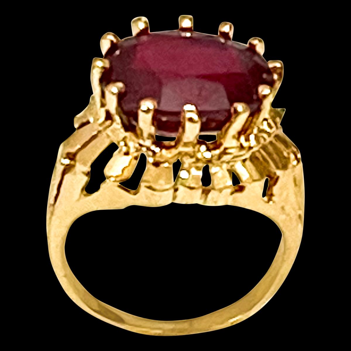  Oval  Cut  7 Carat Treated Ruby in 18 Karat Yellow Gold Ring, Unisex Size 5.5
It is a Unisex ring 
Its a treated ruby prong set, Multiple prongs are breath taking.
18 Karat Yellow Gold: 7.2 gram
Ring Size 5.5 ( can be altered for no charge