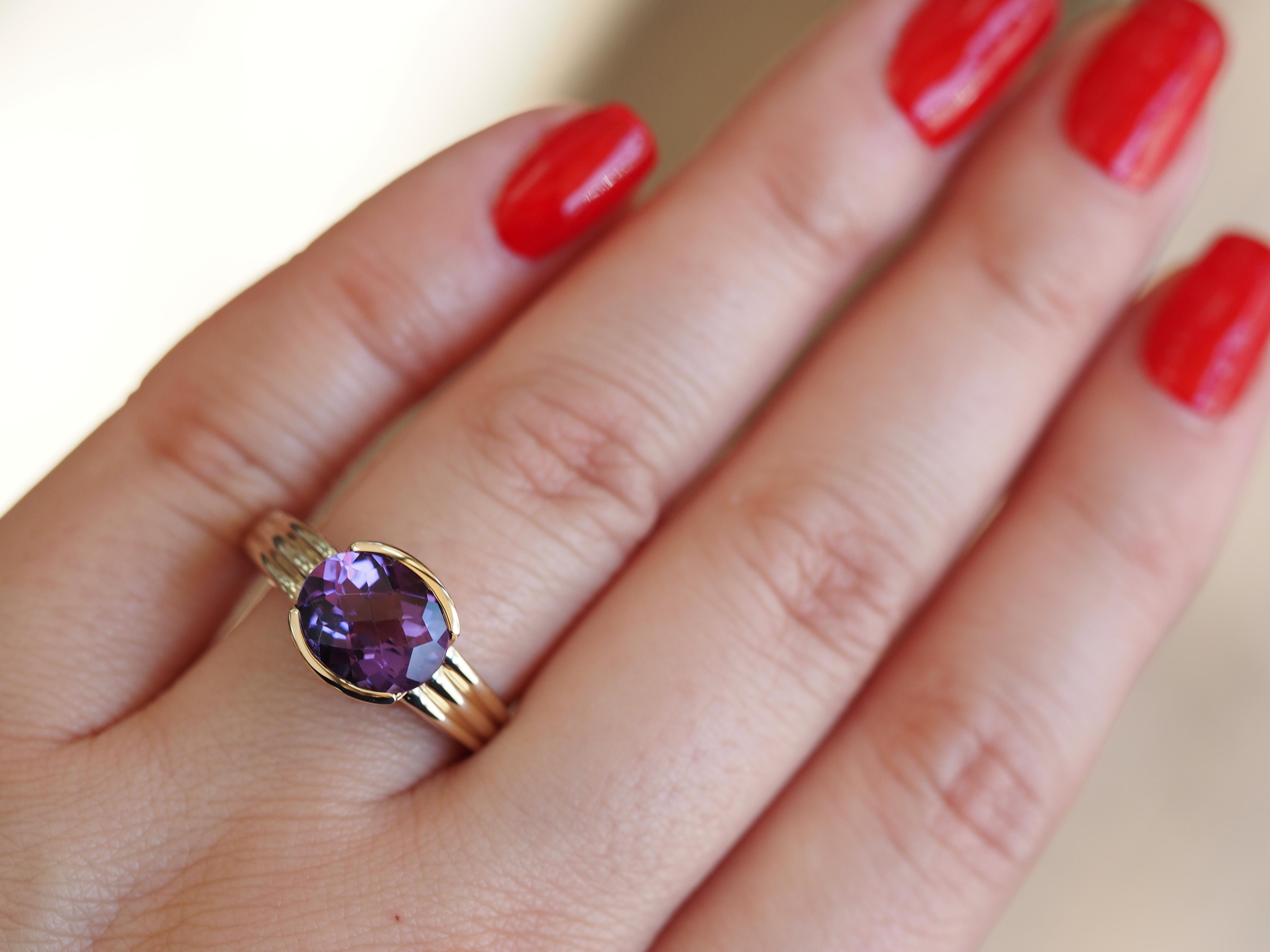 Absolutely gorgeous, this retro style ring is the perfect statement accessory. The ring is fashioned in classic 14 karat yellow gold and features a royal-purple amethyst center. Size 9, can be sized up or down upon request prior to shipping.

Metal
